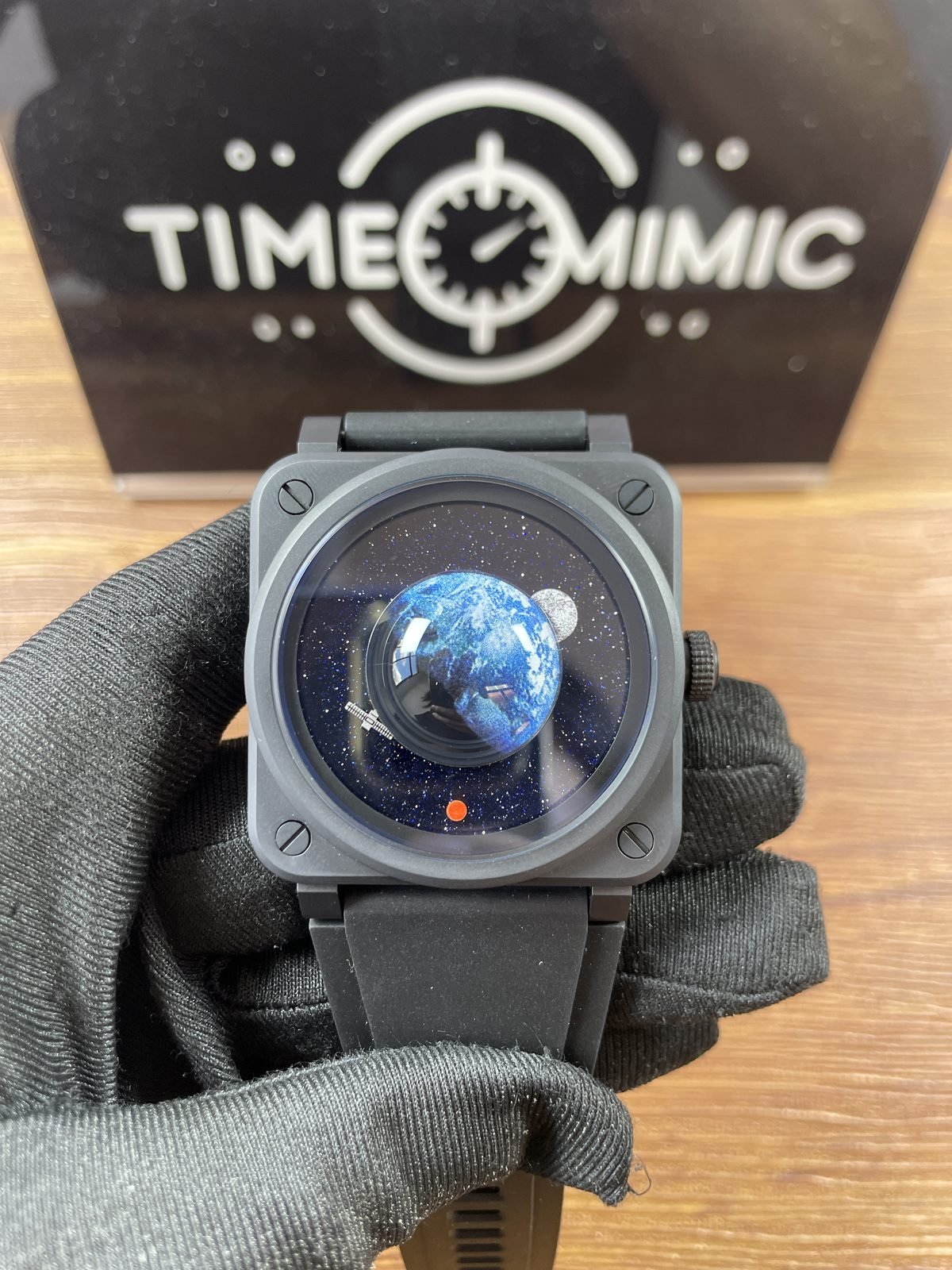 Bell and Ross BR-03 Astro replica deep blue star field dial raised Earth Moon Mars satellite and orange marker
