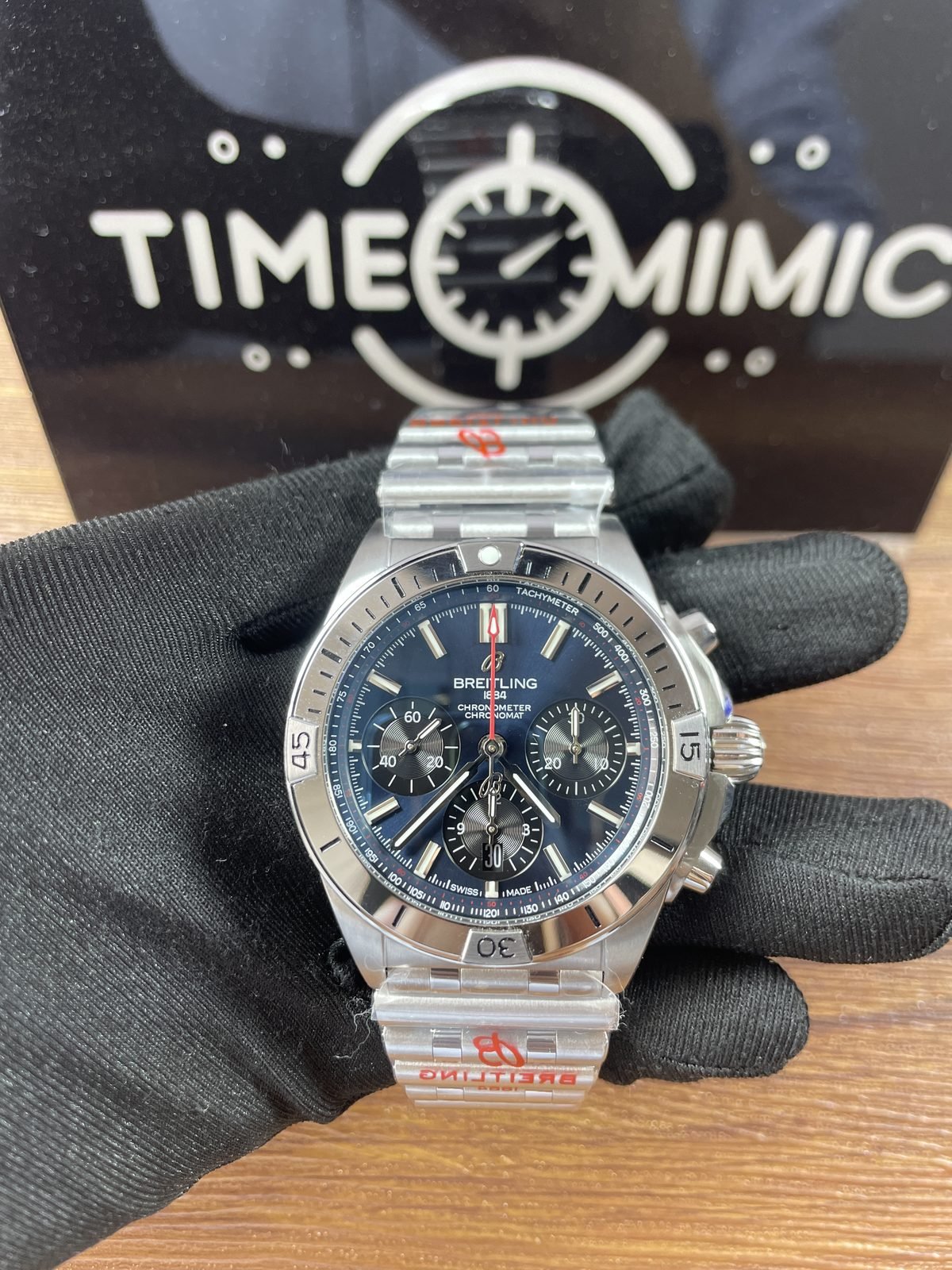 Breitling Chronomat AB0134101C1A1 replica blue dial three counters red chronograph seconds hand rider-tab bezel and Rouleaux-style bracelet front