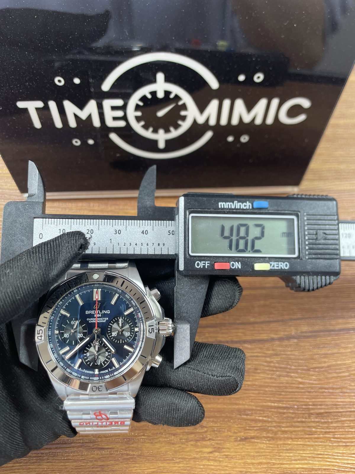 Breitling Chronomat AB0134101C1A1 replica pictured front calliper placement reading 48.2 millimetres across external controls