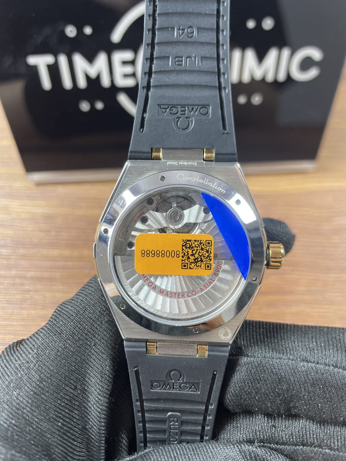 Omega Constellation replica transparent back striped rotor red 8900 markings and orange 80088688 sticker