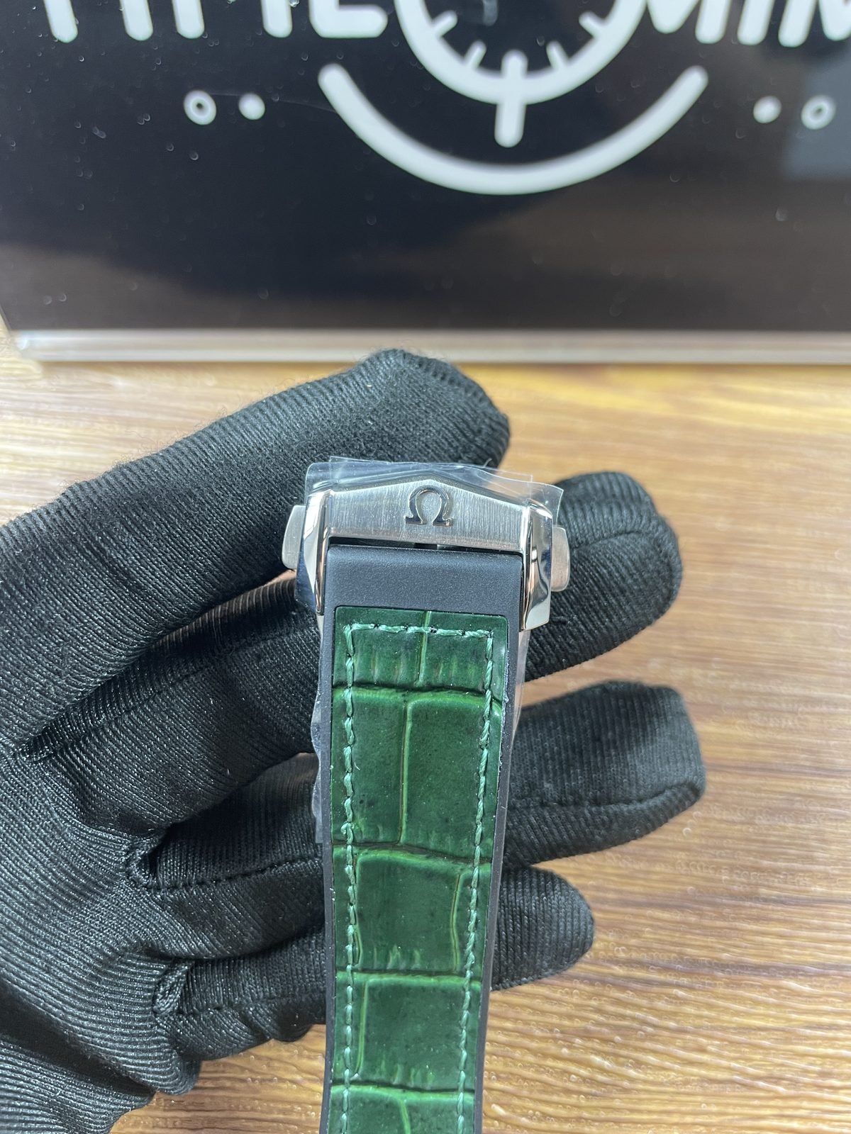 Omega Constellation replica green crocodile pattern strap and folding clasp under protective film