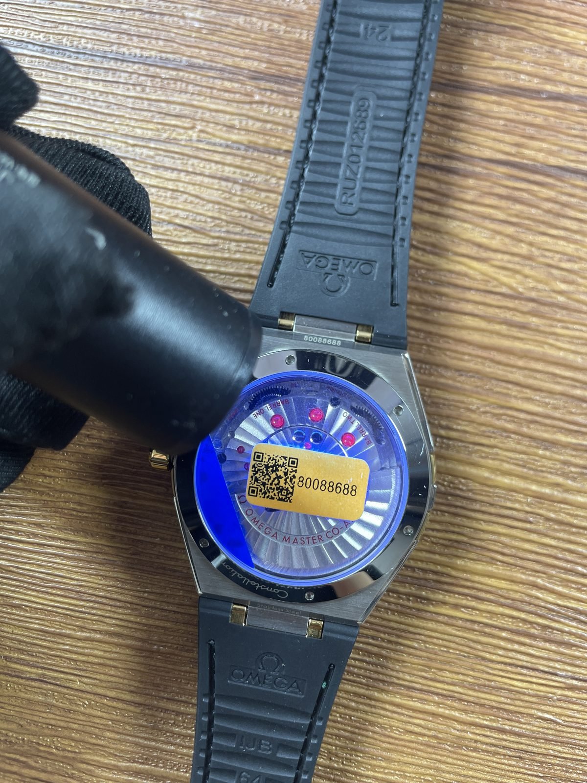 Omega Constellation replica displayed movement under blue ultraviolet style inspection light