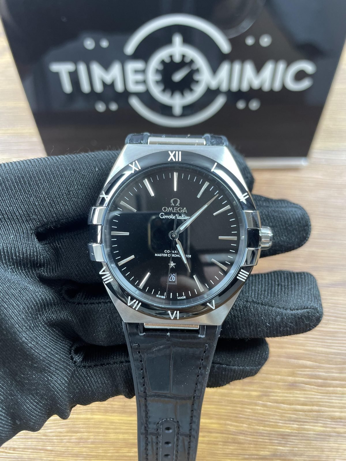 Omega Constellation 131.33.41.21.01.001 replica black dial Roman numeral bezel and black strap front
