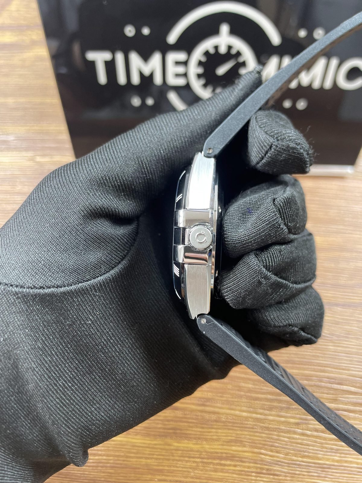 Omega Constellation black dial replica crown side brushed steel tone case and polished claws