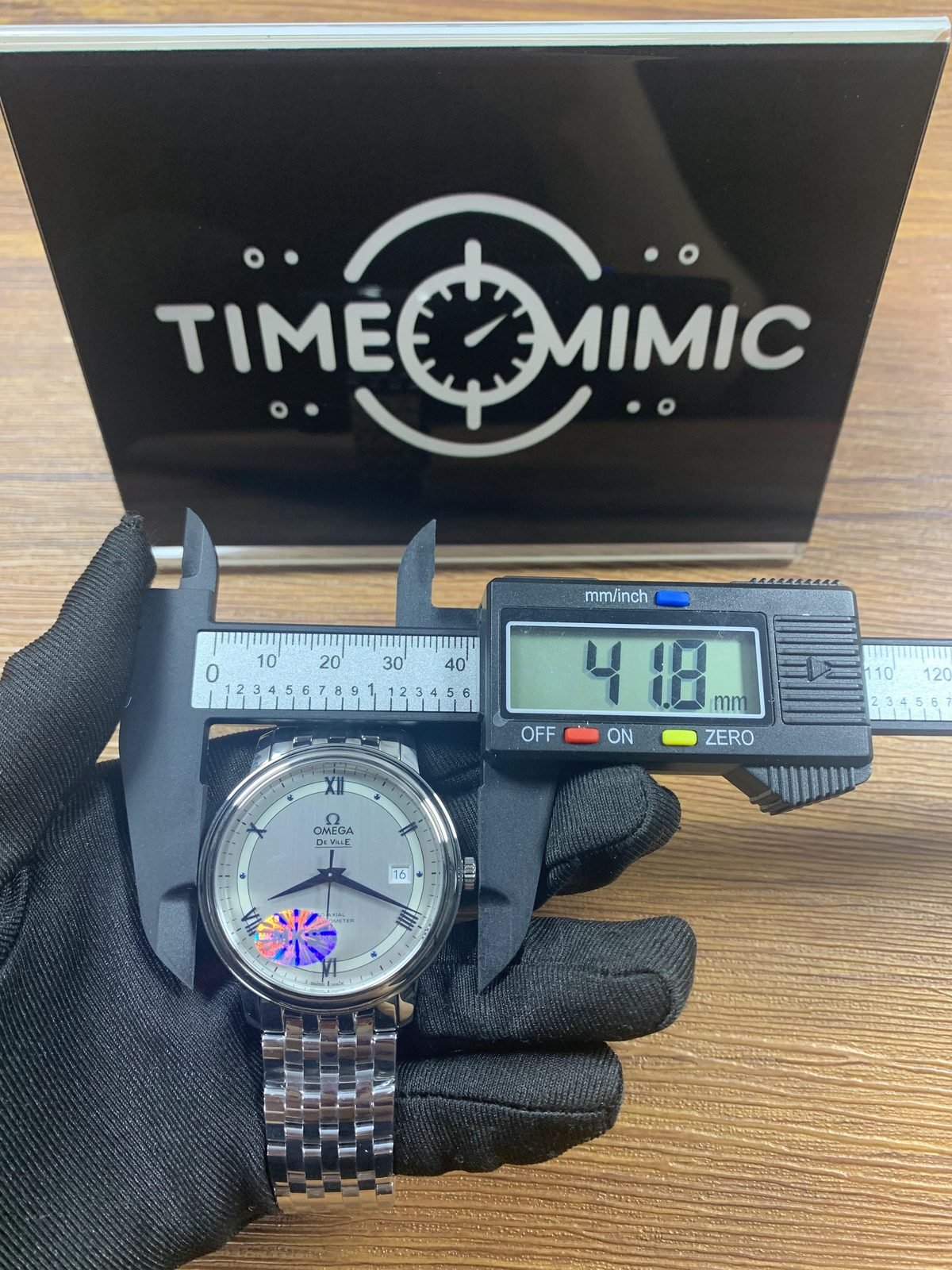 Omega De Ville replica horizontal caliper placement reading about 41.8 millimetres across the crown direction