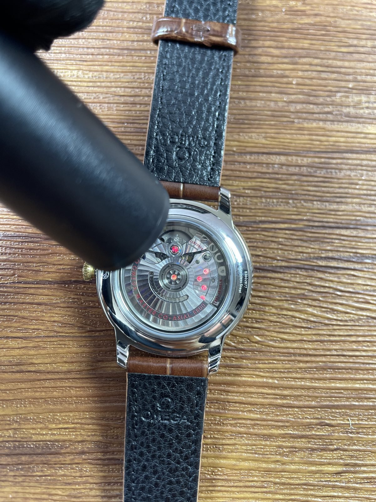 Omega De Ville replica movement appearance illuminated through transparent back
