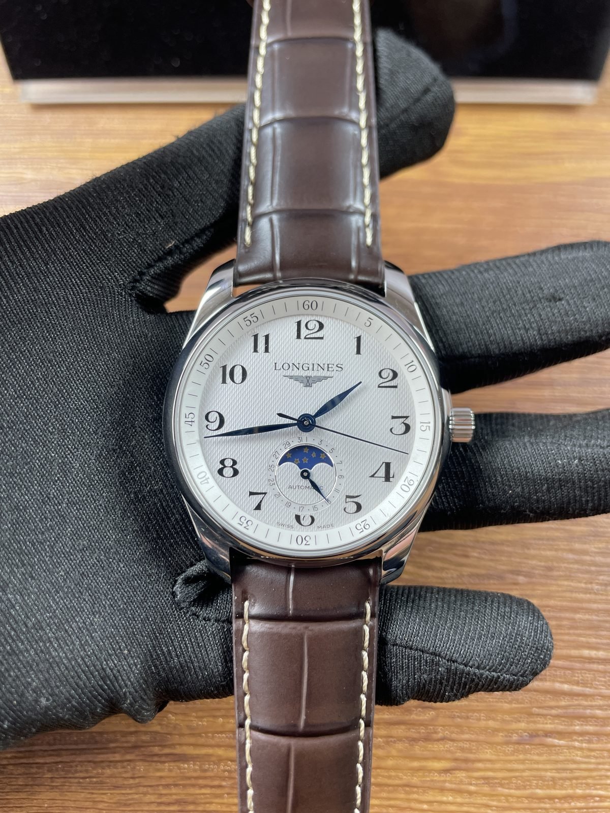 Longines Master Collection L2 909 4 78 3 replica silver textured dial Arabic numerals blue tone hands moonphase date brown strap