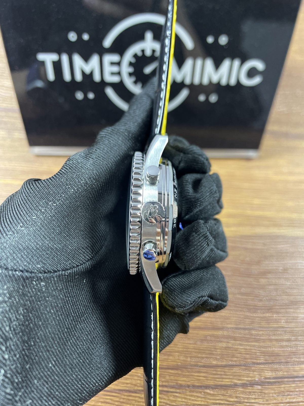 Breitling Navitimer AB0138211B1P1 replica coin-edge bezel crown two pushers polished steel-tone case and yellow strap lining side