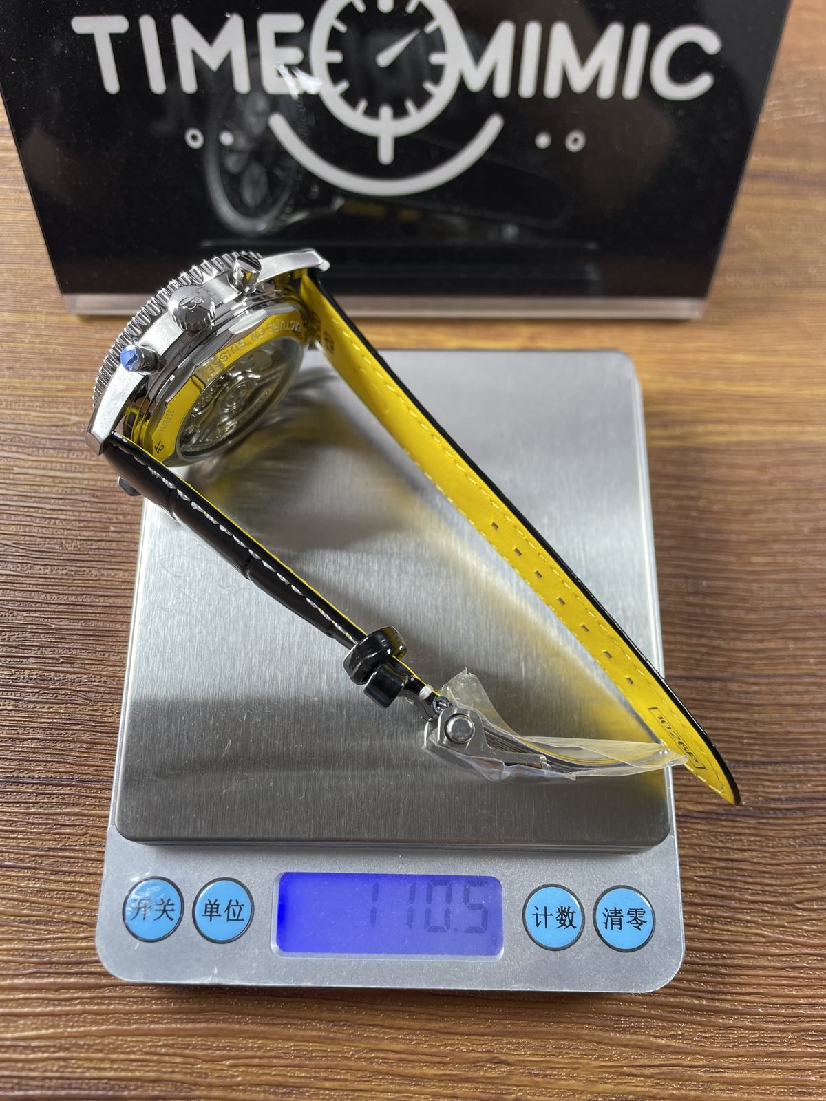 Breitling Navitimer AB0138211B1P1 replica pictured consumer scale reading 110.5 grams with strap and protective film