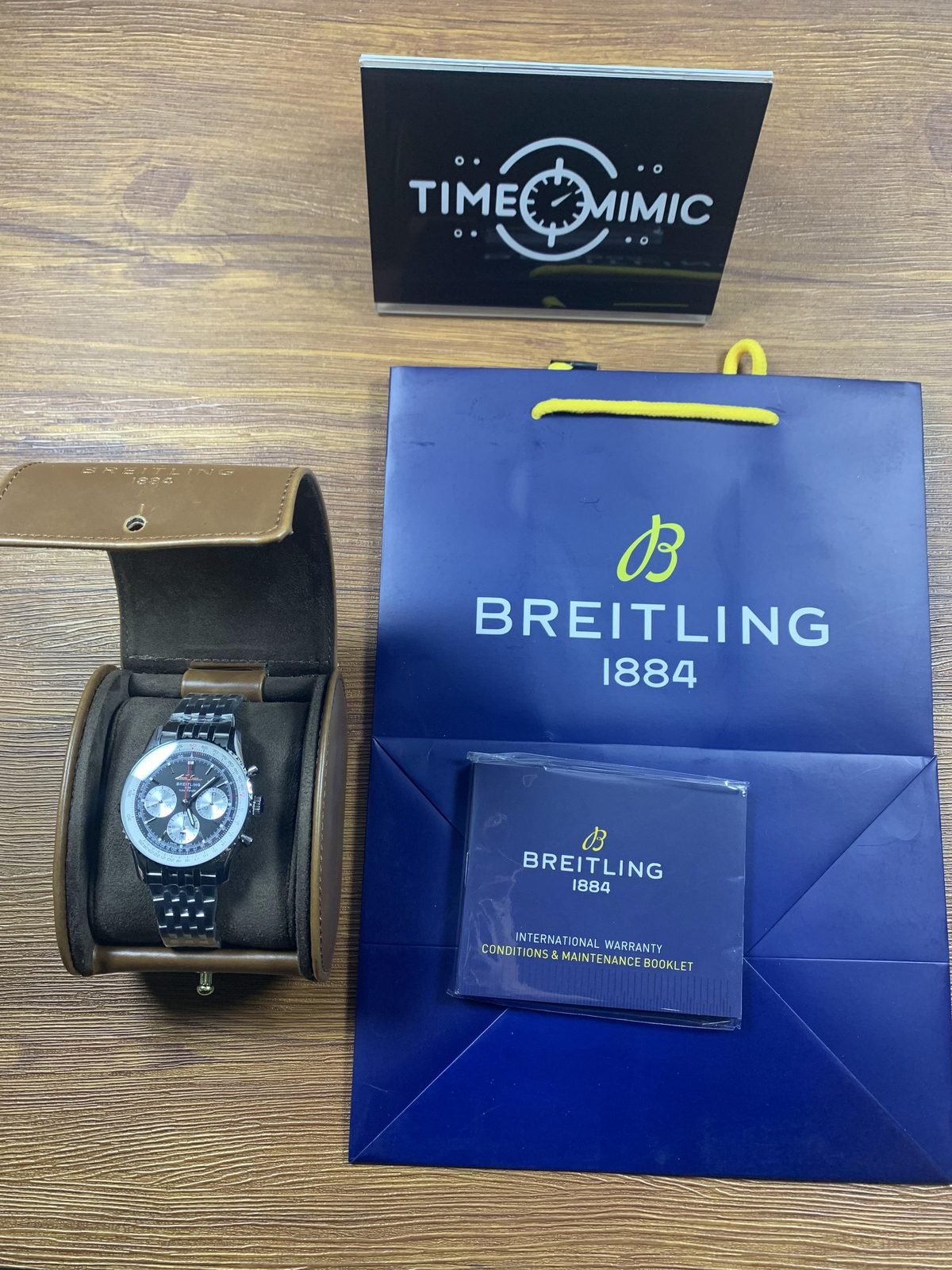 Breitling Navitimer AB0139211B1P1 listing sample watch box paper bag and booklet style props overview