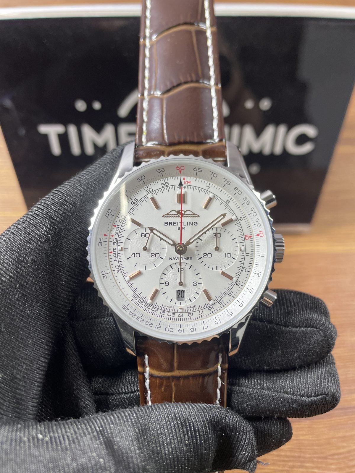 Breitling Navitimer AB0139211G1P1 replica silver white tonal three-counter dial brown embossed strap front