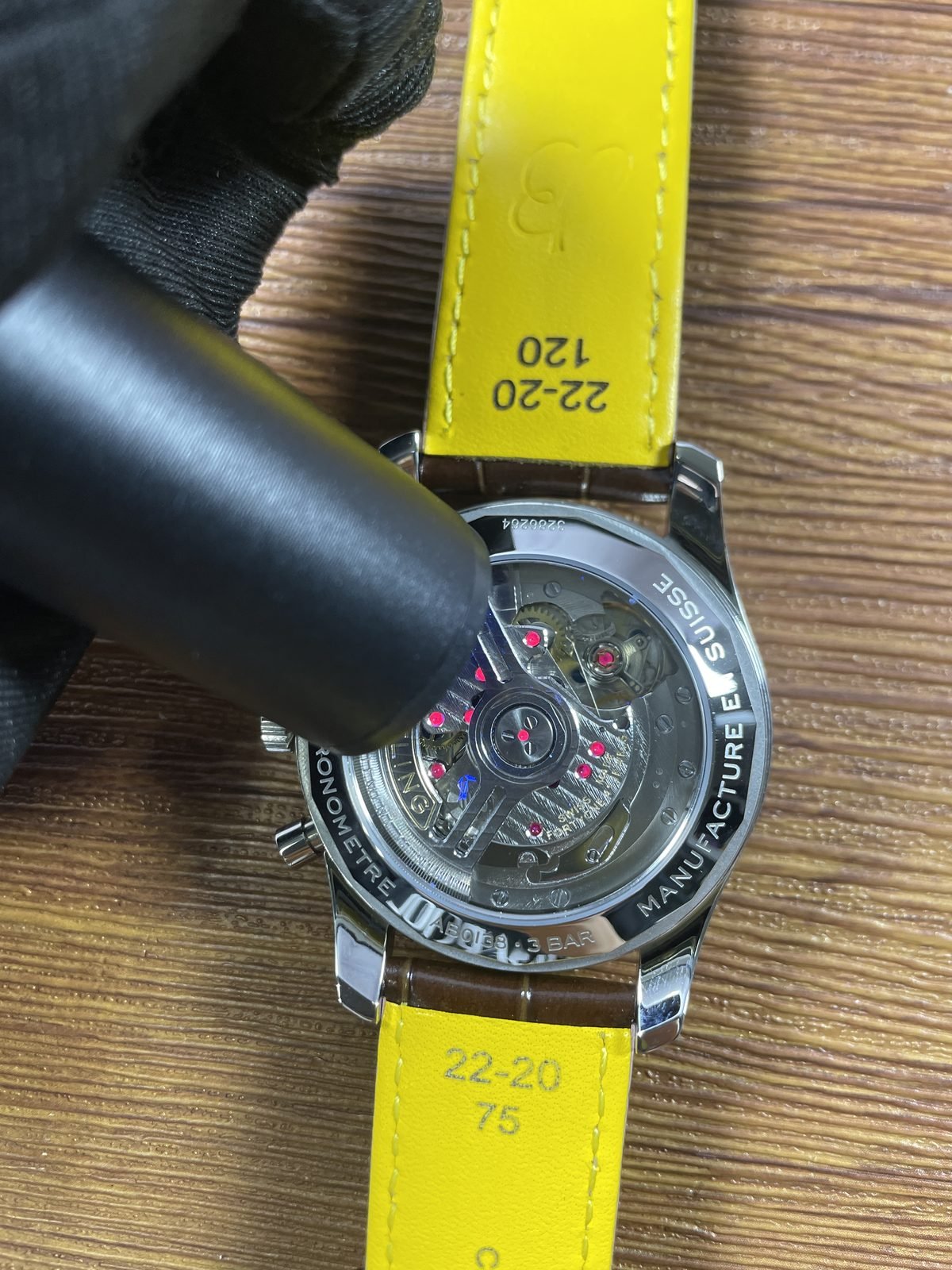 Breitling Navitimer AB0139211G1P1 replica exhibition back under ultraviolet-style light