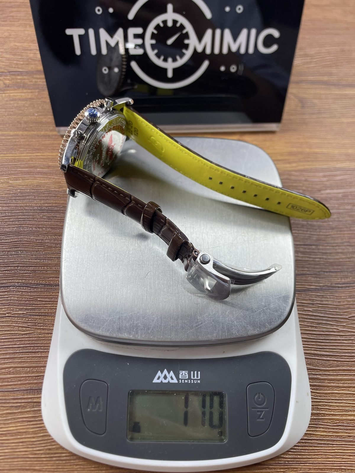 Breitling Navitimer Custom replica pictured consumer scale reading about 110 grams