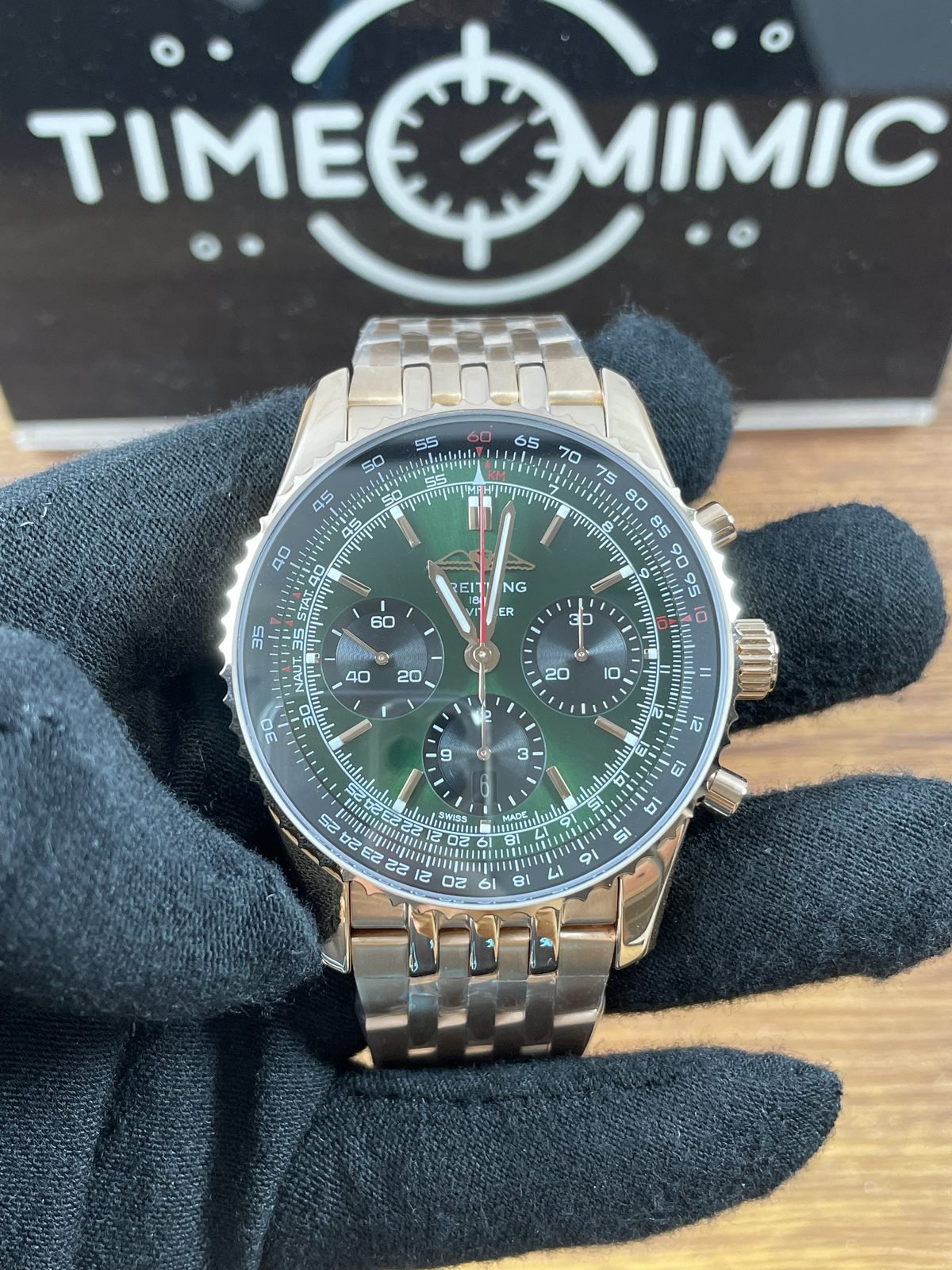 Breitling Navitimer RB0137241L1R1 replica green dial dark three registers warm rose gold tone bracelet front
