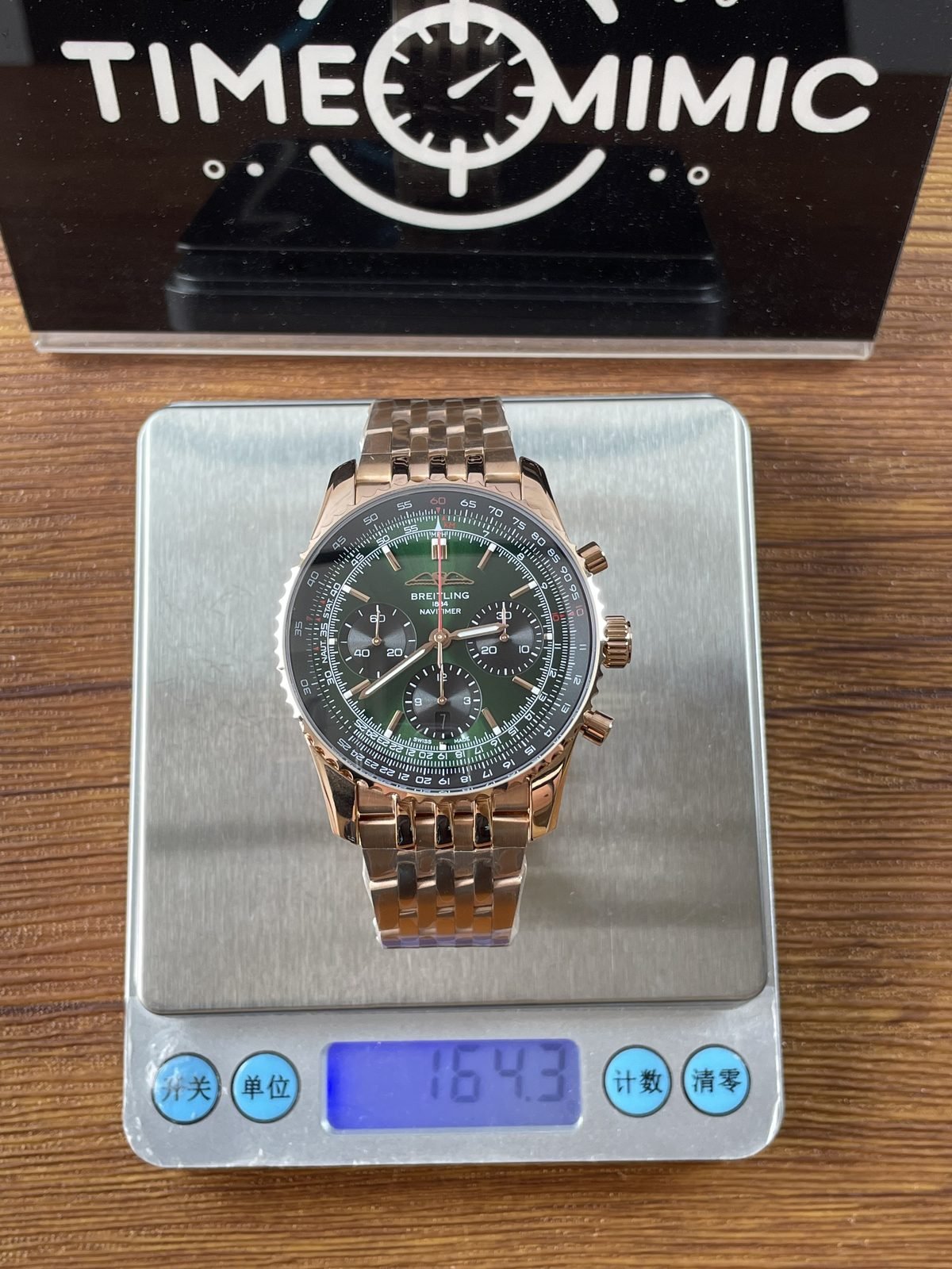 Breitling Navitimer RB0137241L1R1 replica pictured consumer scale reading 164.3 grams with protective film