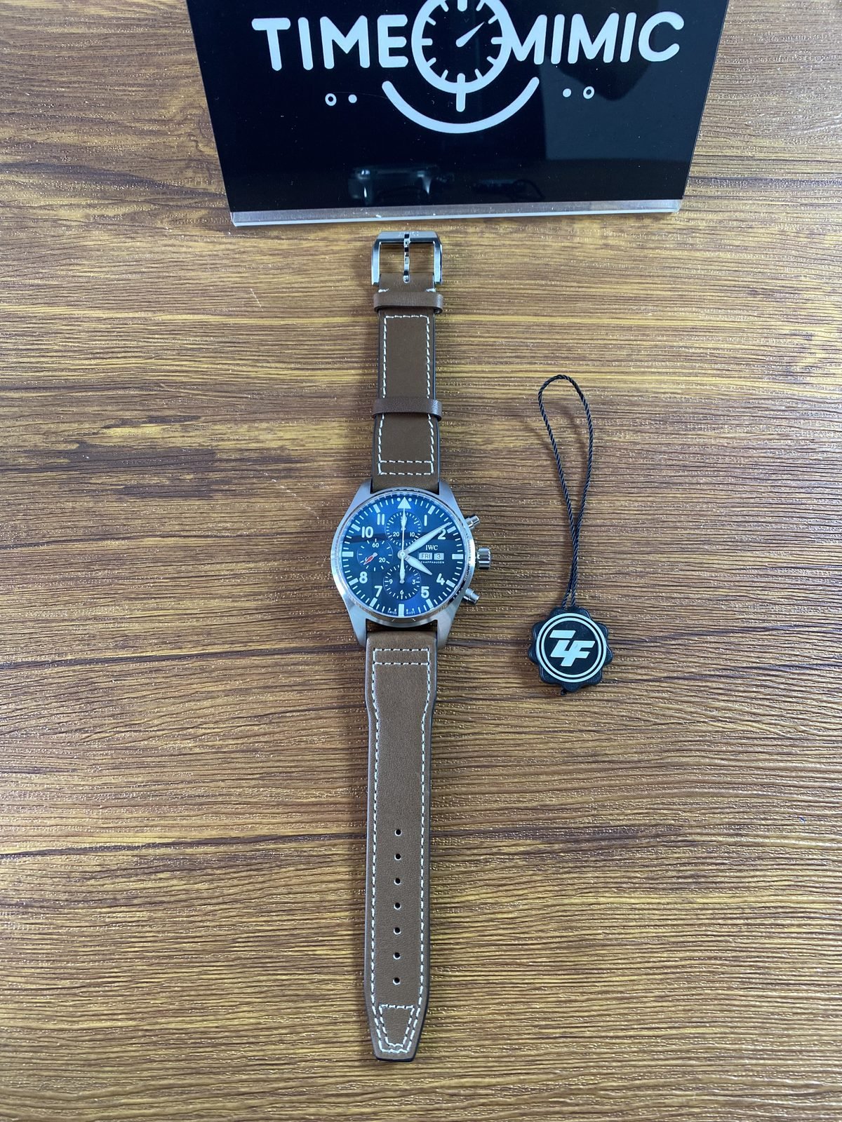 IWC Pilot IW377714 replica full watch beside black ZF tag which is not factory proof