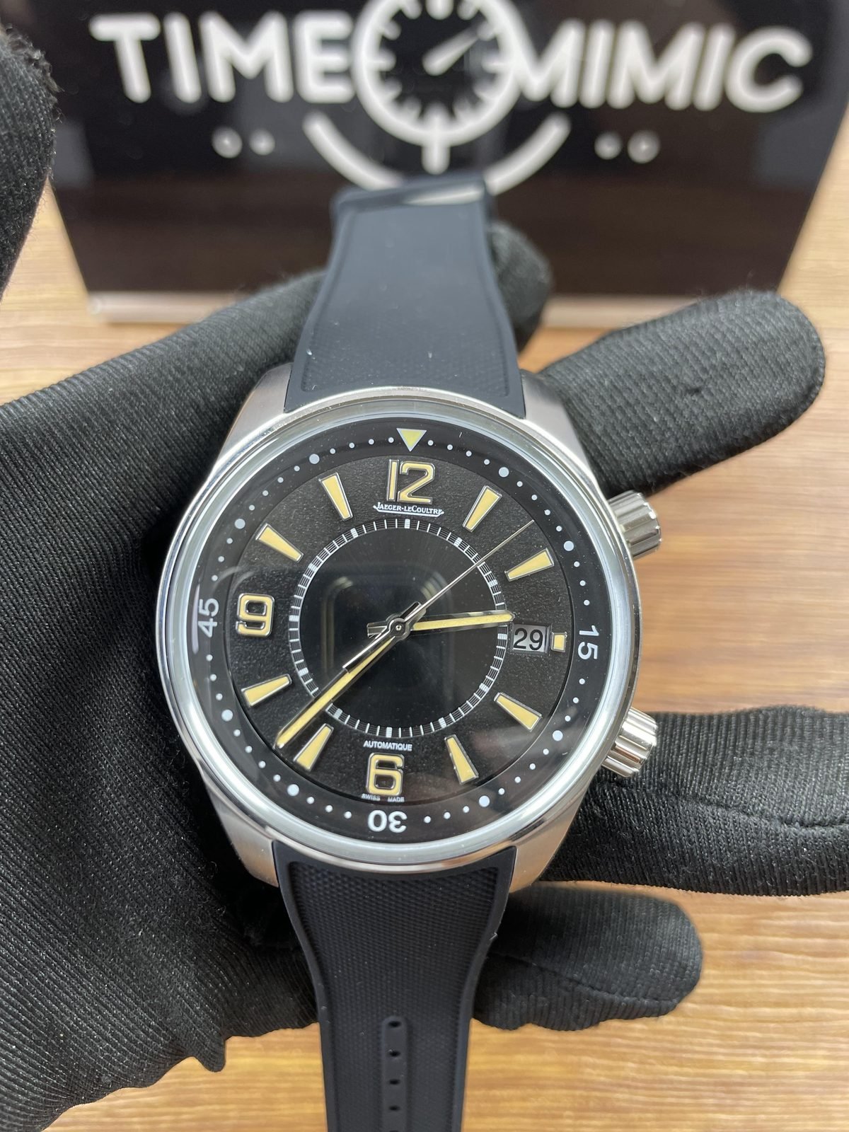 Jaeger LeCoultre Polaris Q9068670 replica black layered dial large 12 9 6 numerals two crowns date 29 and rubber style strap