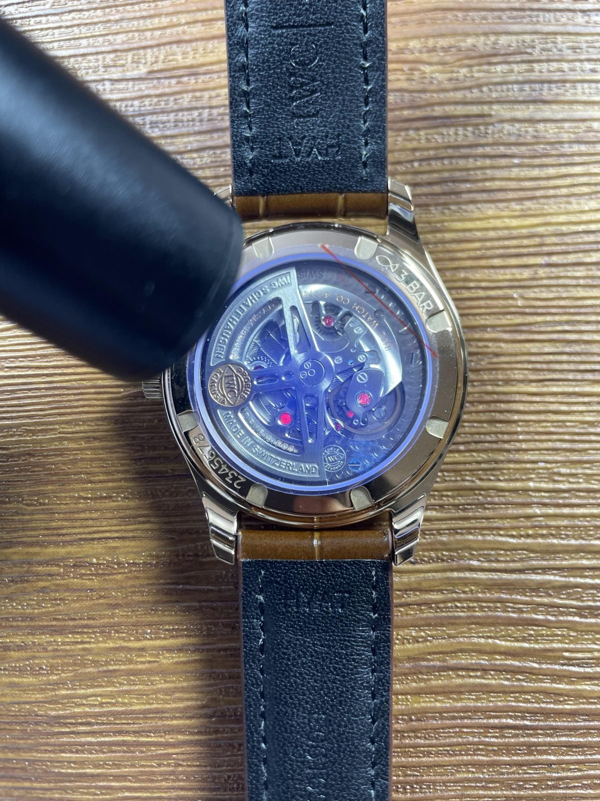 IWC Portugieser IW358306 replica exhibition back under blue violet inspection light