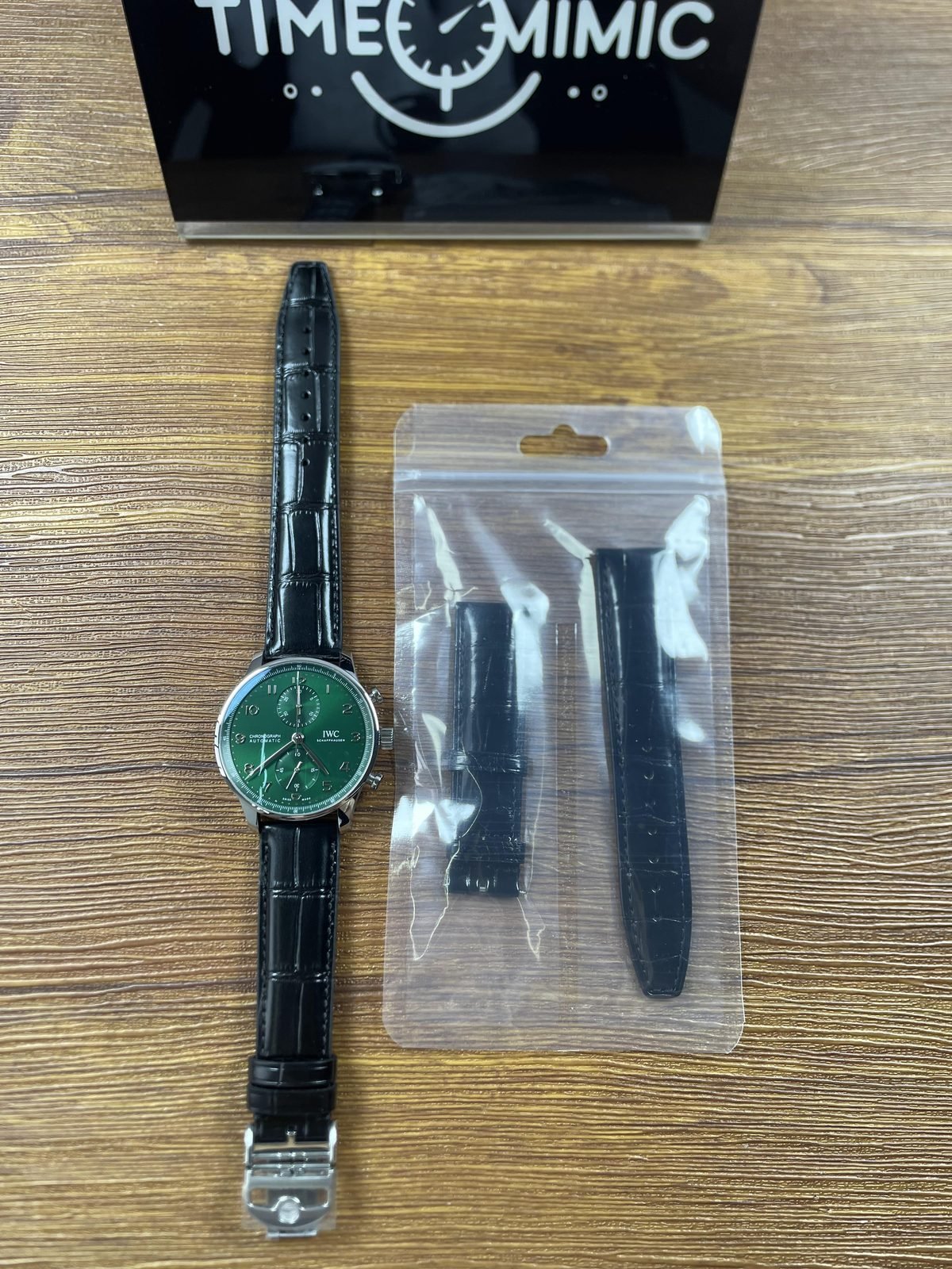 IWC Portugieser IW371615 replica green dial watch with loose black crocodile pattern spare strap bag full view