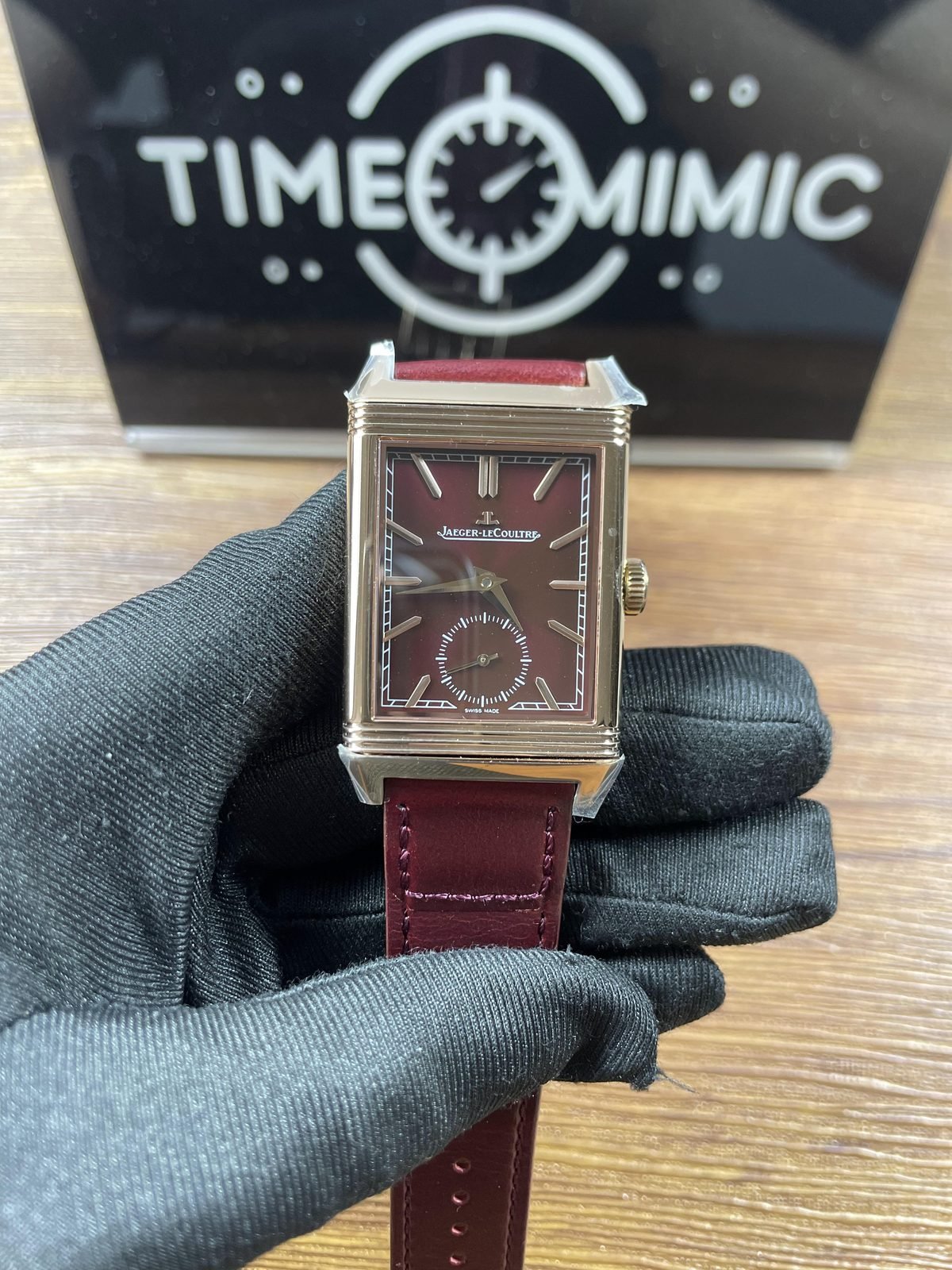 Jaeger LeCoultre Reverso 398256J replica burgundy rectangular dial small seconds warm metal colour case and strap