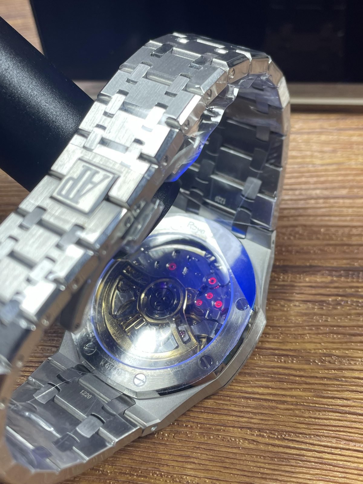 Royal Oak 15510ST 07 replica exhibition back movement close-up under blue or ultraviolet-style light