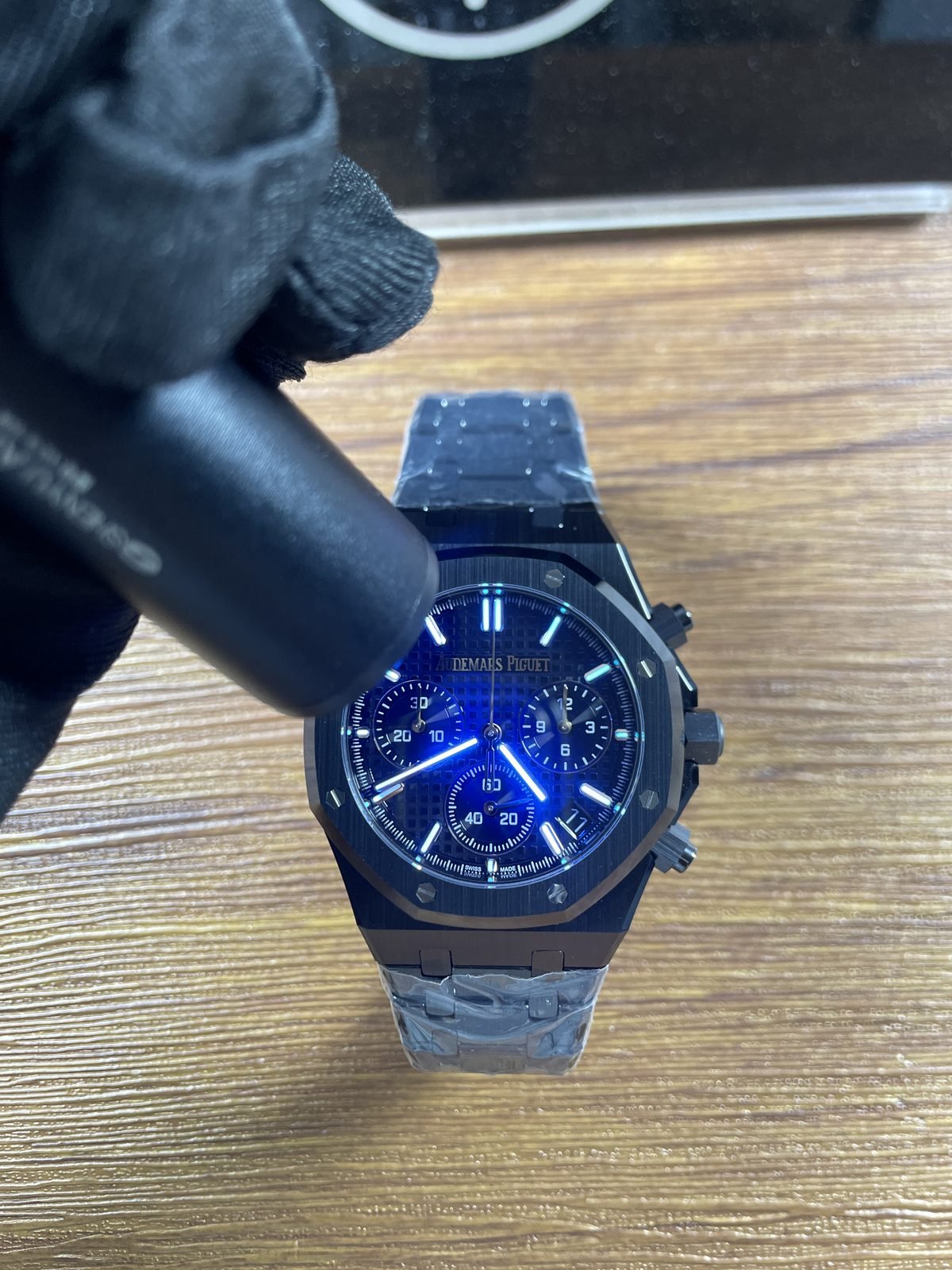 Royal Oak 26240CE replica dial hands and markers under blue ultraviolet-style light
