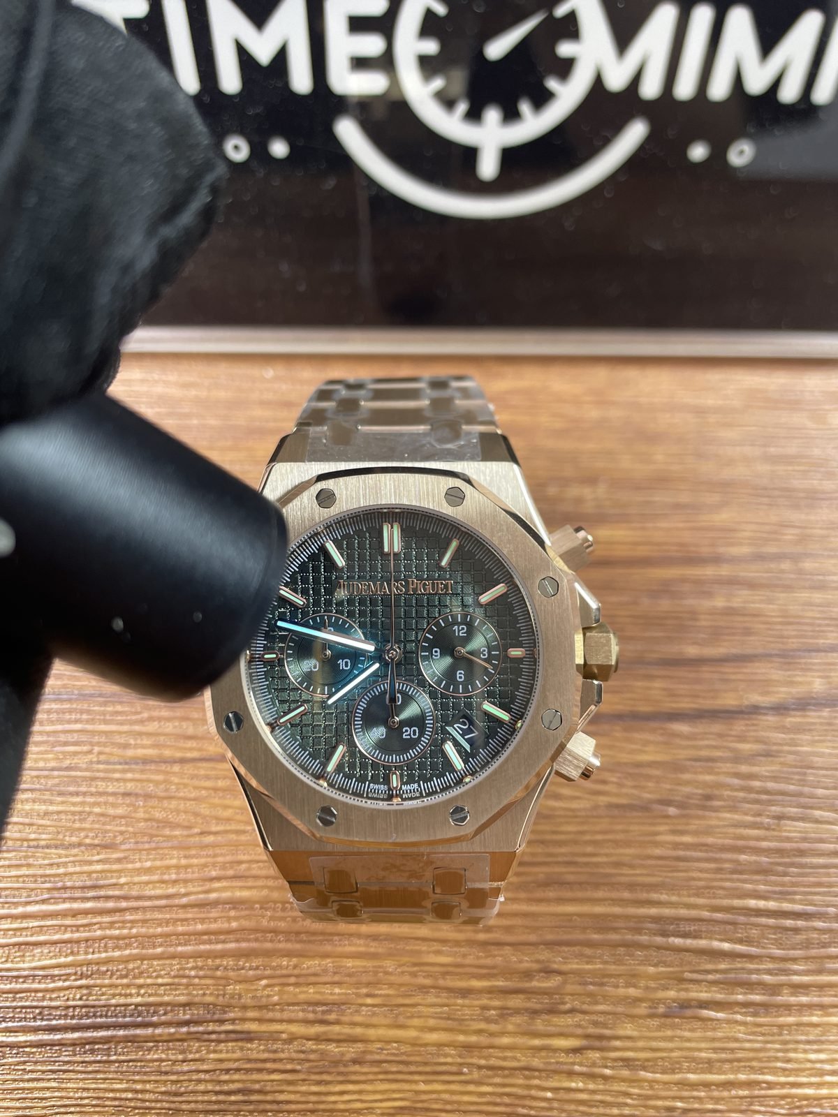 Royal Oak 26240OR replica green dial hands and markers under blue ultraviolet-style light