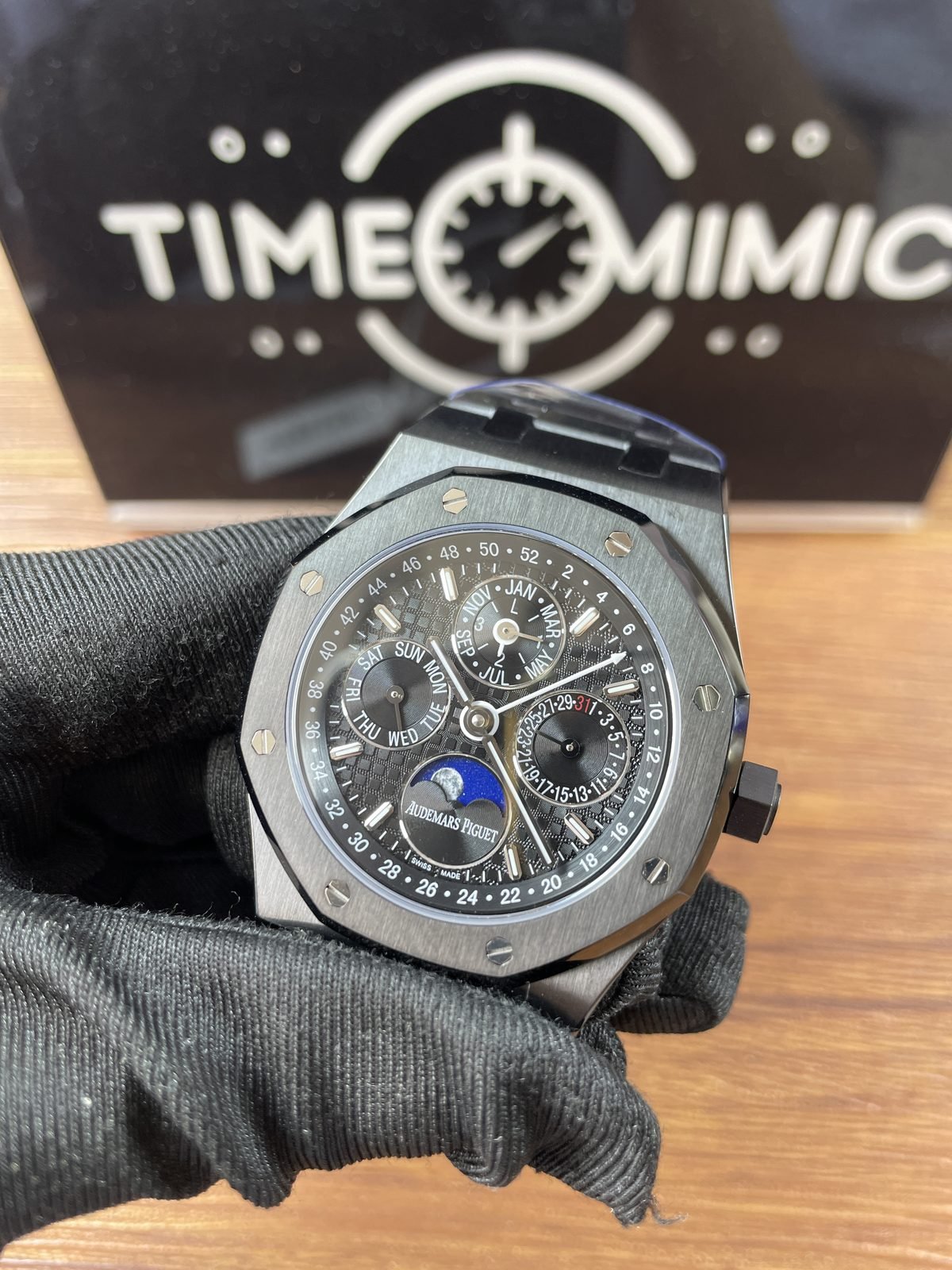 Royal Oak 26574 family replica dark perpetual calendar dial and octagonal case angled front view