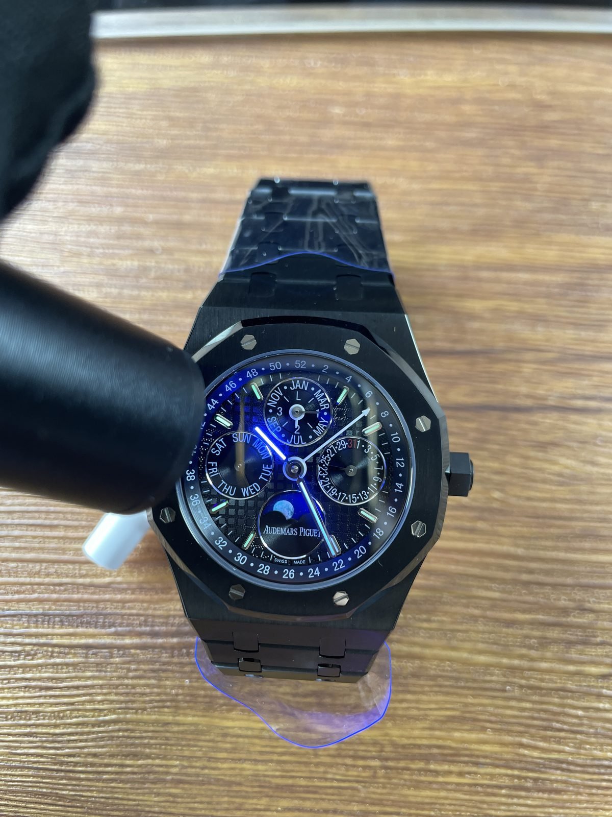 Royal Oak 26574 family replica hands and hour markers under blue UV style light