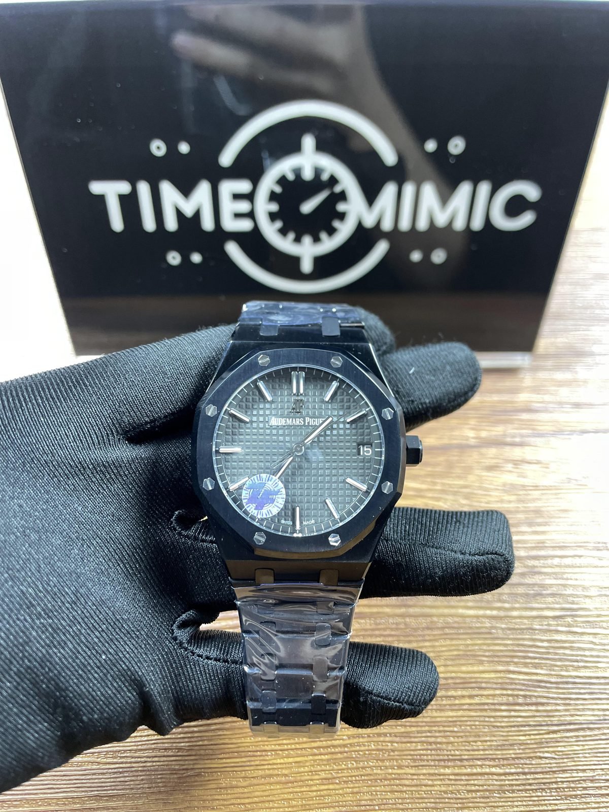 Royal Oak 77350CE replica listing sample dark square-pattern dial date fifteen and integrated bracelet under protective film