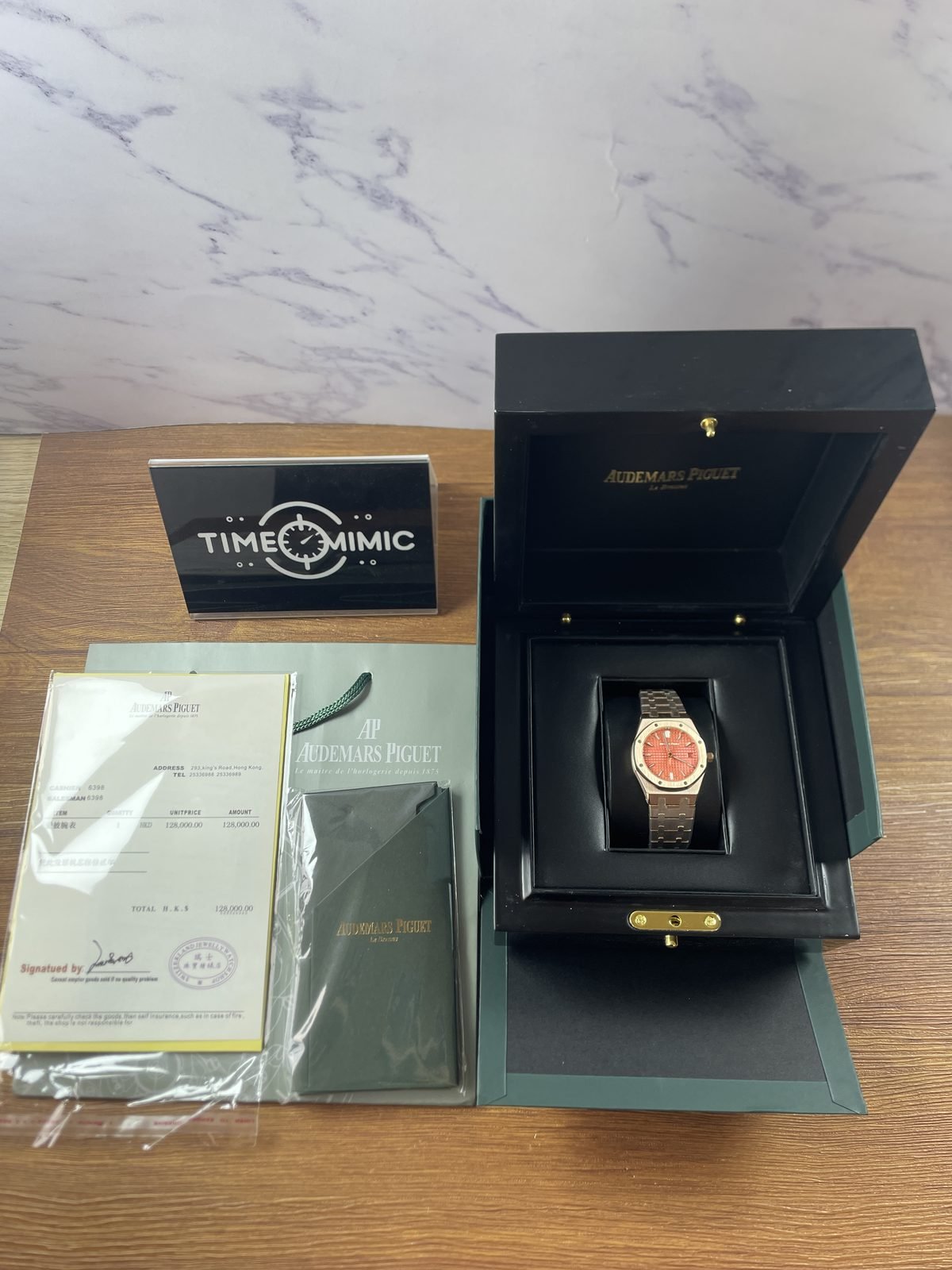 Royal Oak 77450OR replica listing sample displayed in an open branded-style presentation box