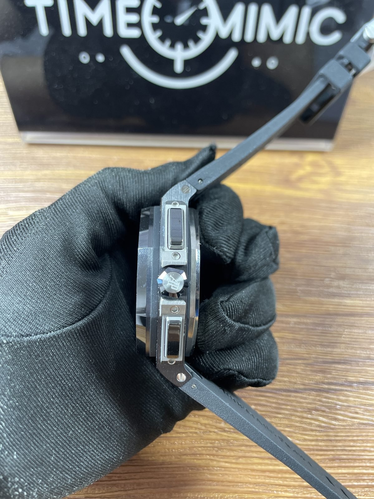 Royal Oak Offshore 26402CE replica side view crown rectangular pusher details dark case and strap