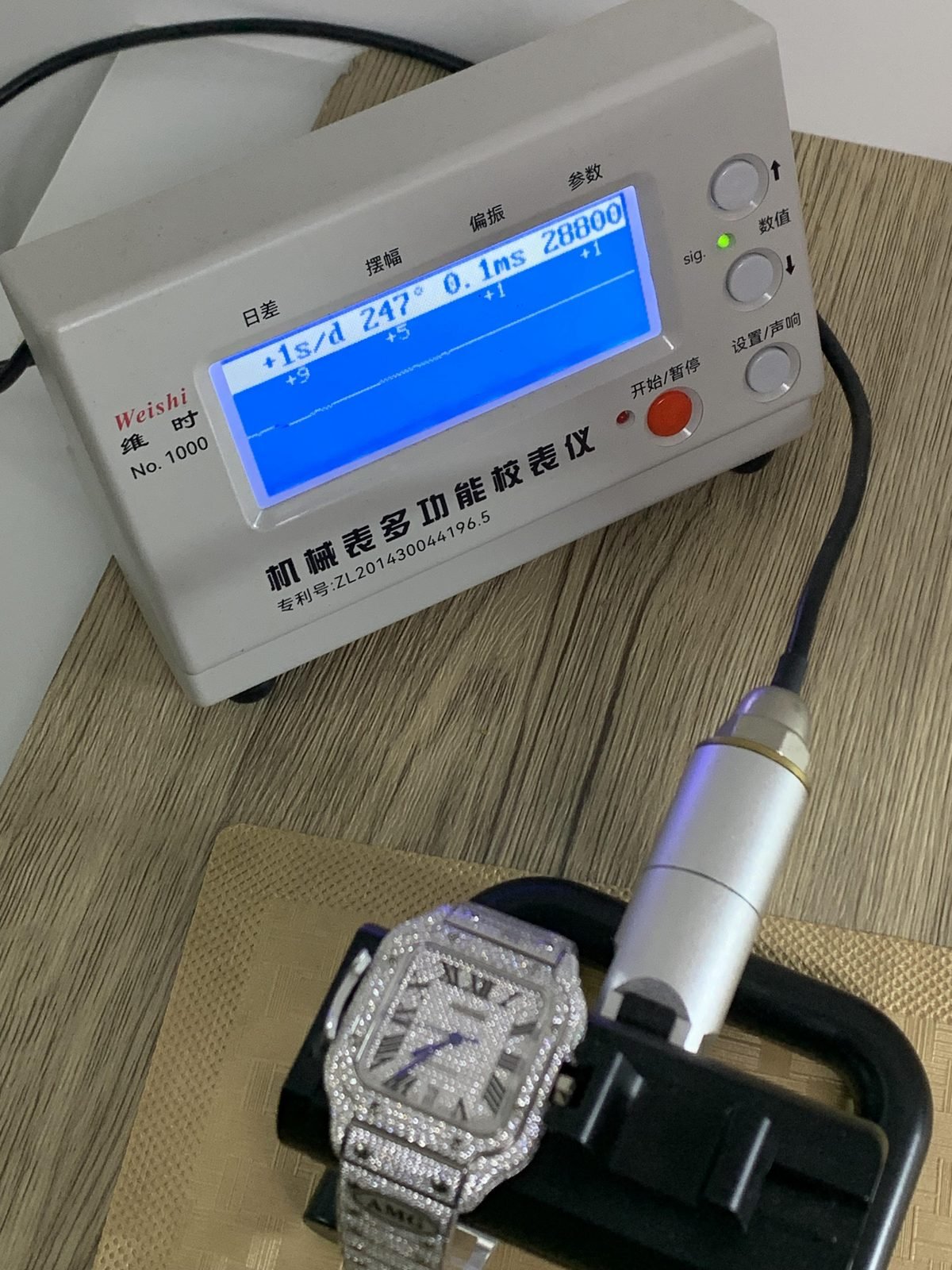 Watch photographed on a timegrapher during a visible QC step