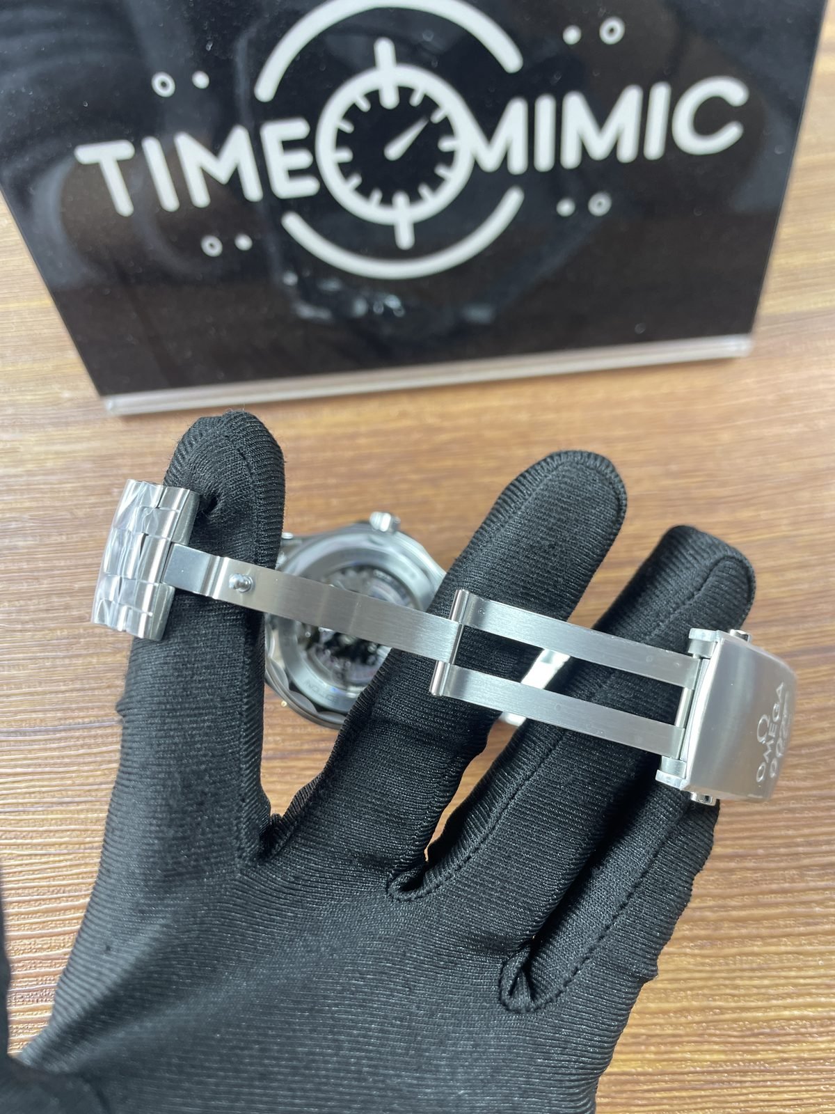 Open steel tone folding clasp and bracelet linkage
