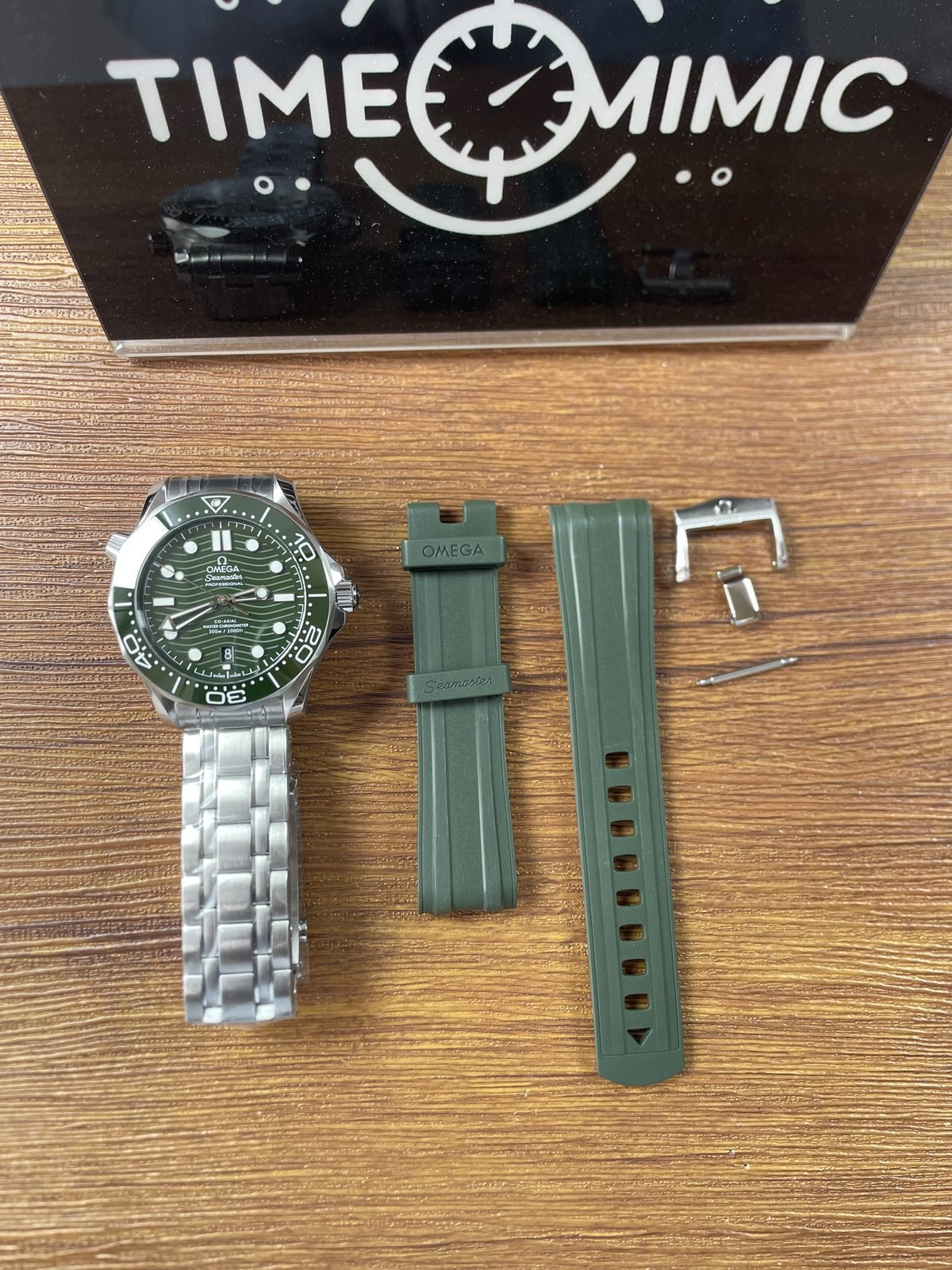 Green Omega Seamaster Diver 300M style replica with steel bracelet and separate green strap buckle and spring bar