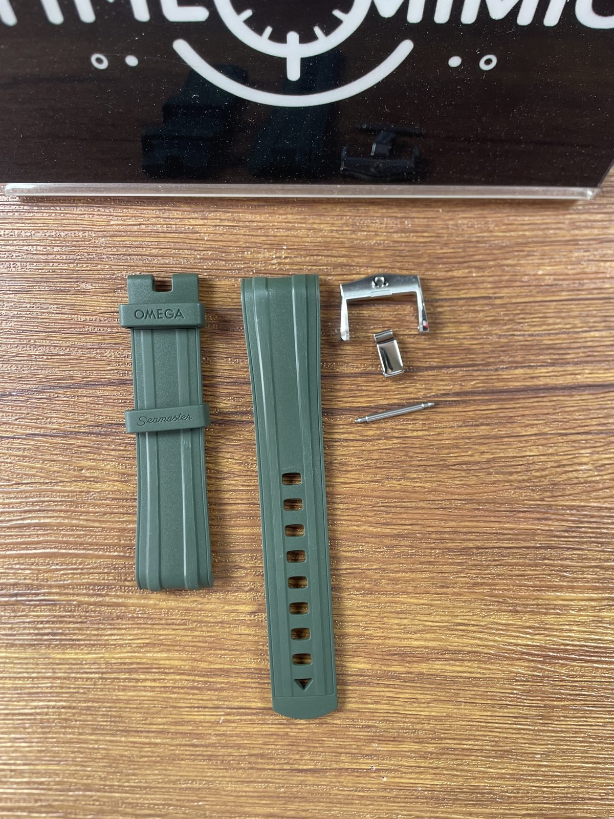 Green rubber style strap front with keepers pin buckle and spring bar