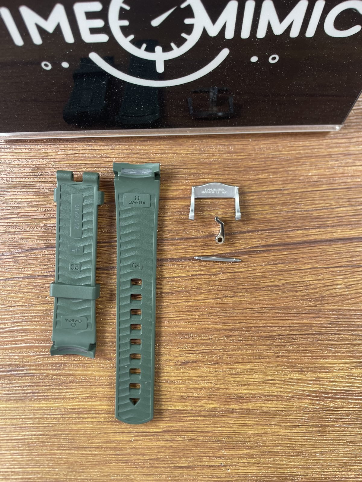 Green strap underside with Omega 20 and code style moulding plus buckle underside