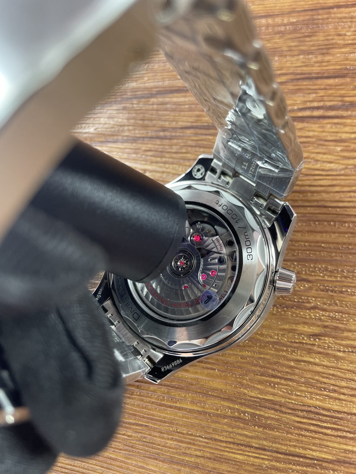 Transparent caseback and decorated automatic looking movement with 8800 style markings