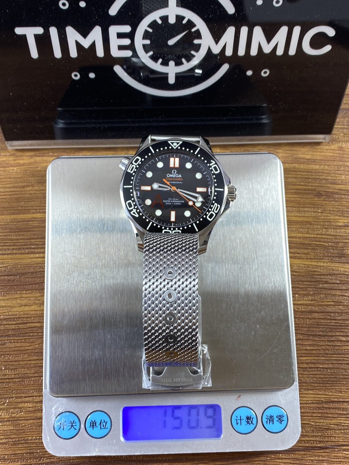 Complete protected mesh bracelet watch on digital scale reading about 150.9 grams