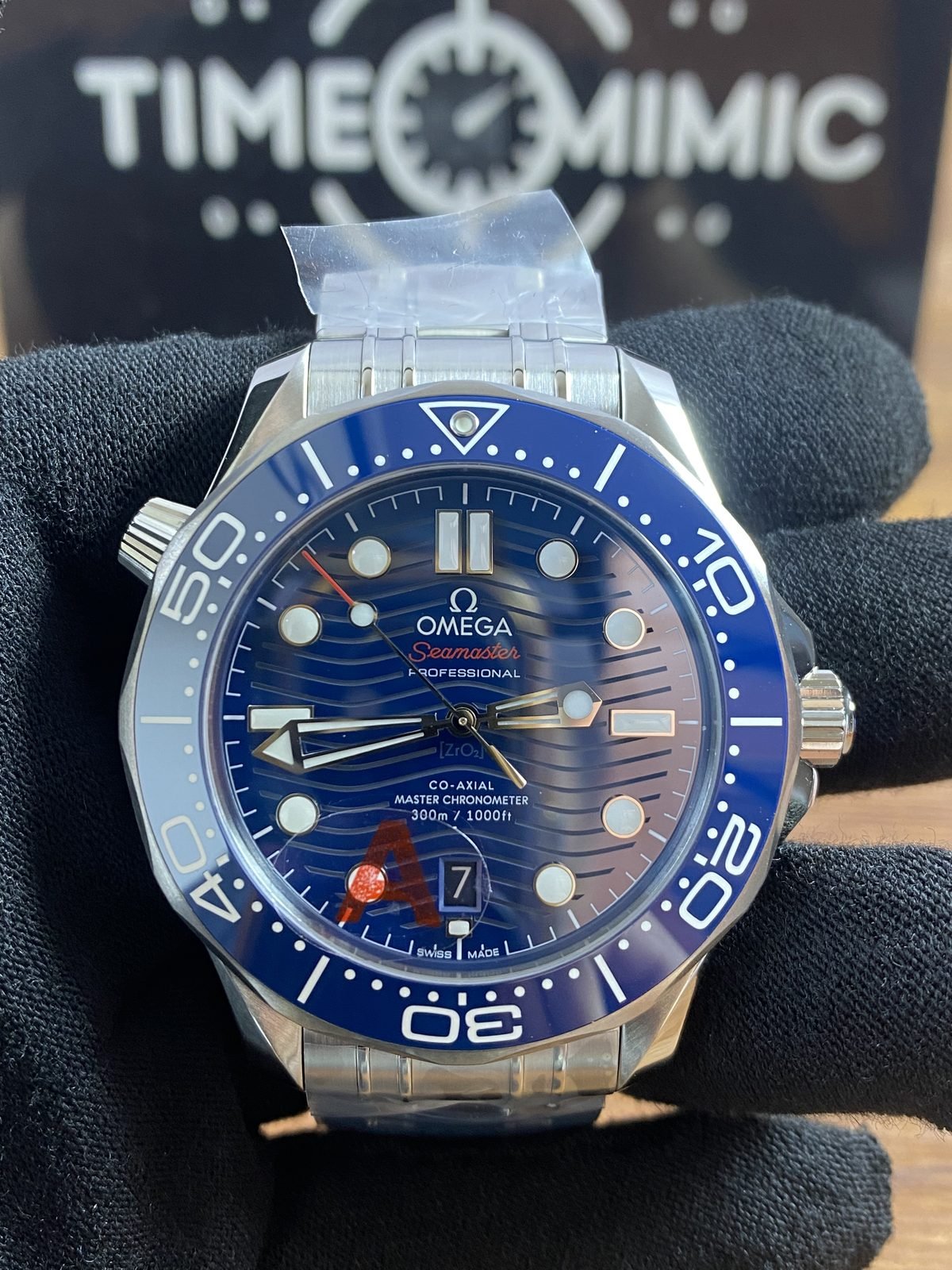 Close front view of blue wave dial and blue bezel Omega Seamaster 210.30.42.20.03.001 style replica