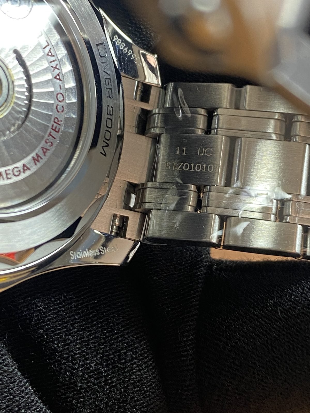 Transparent decorated back with Master Co Axial 8800 style text and bracelet connection