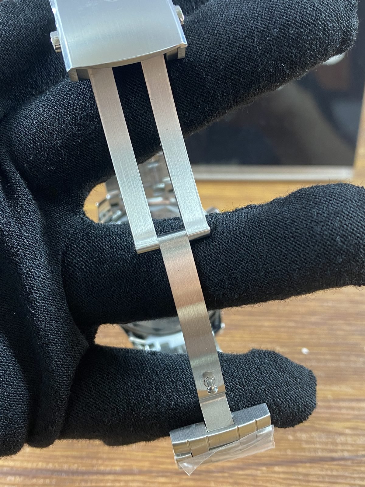 Open folding clasp blades of steel tone Seamaster style bracelet