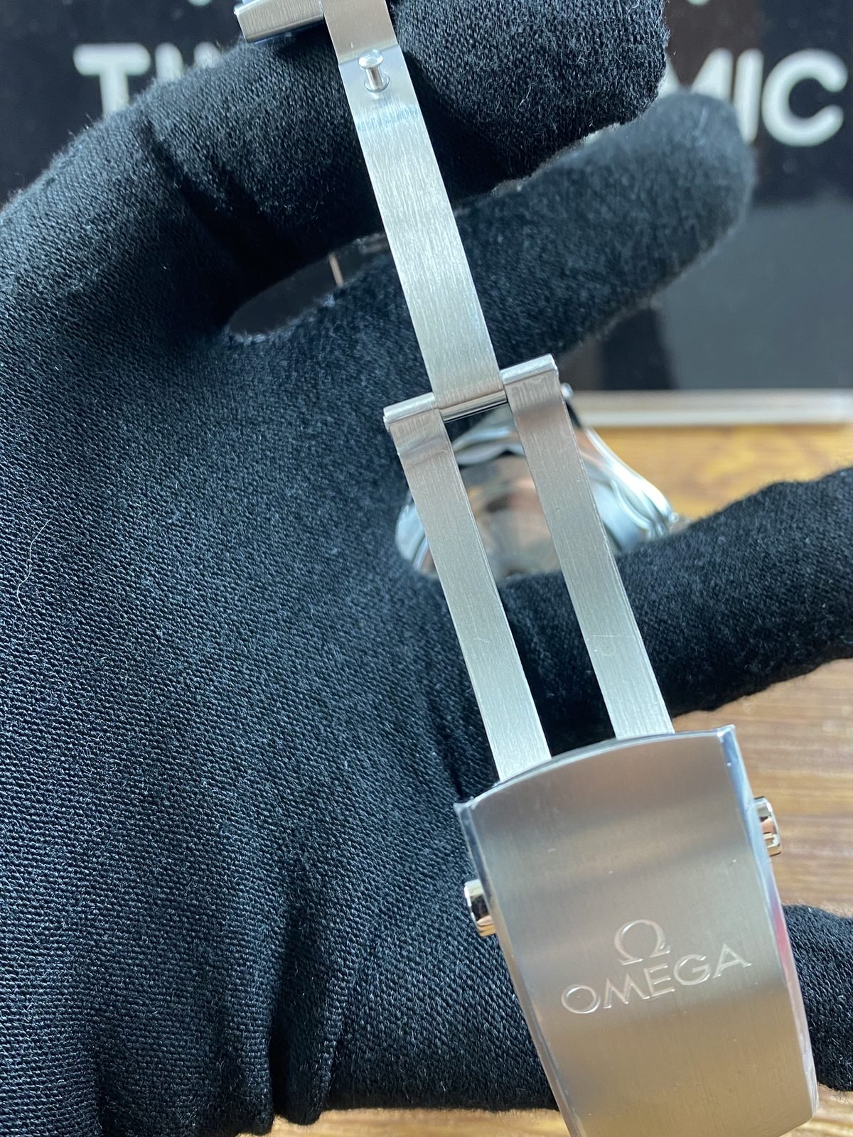 Open folding clasp with long brushed blades and Omega style clasp cover