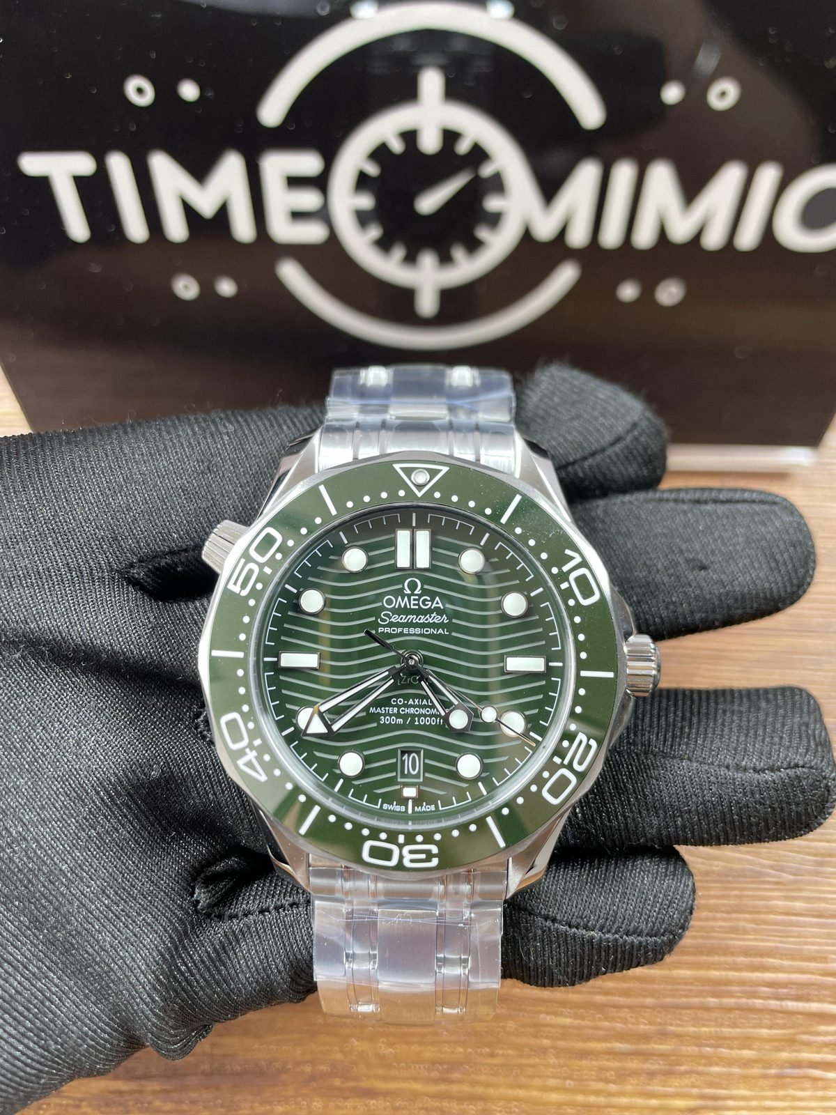 Centered green wave dial and green bezel Omega Seamaster 210.30.42.20.10.001 style replica on steel tone bracelet