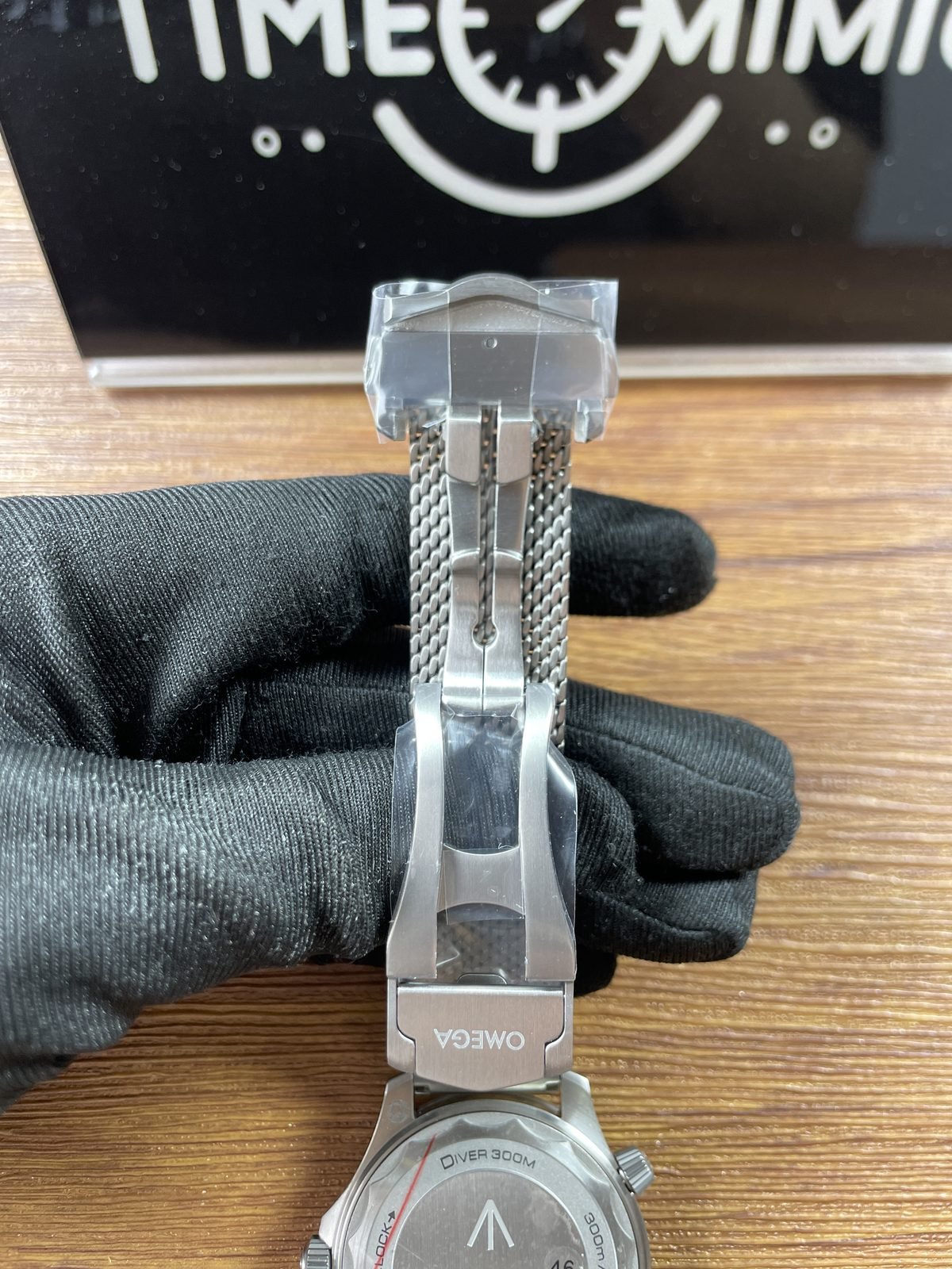 Open folding clasp and underside of mesh bracelet connected to 007 style Seamaster replica