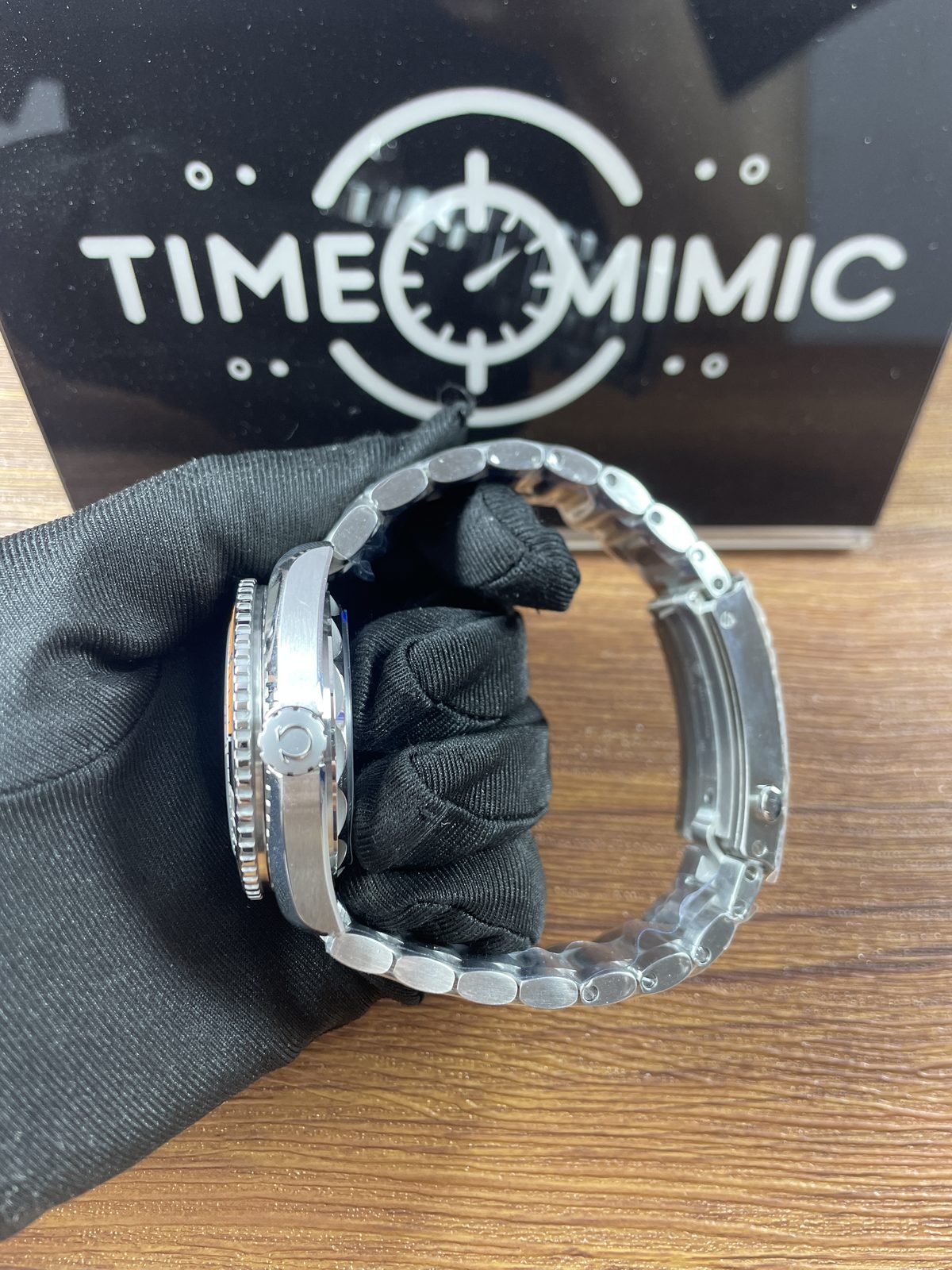 Second left side profile of Planet Ocean replica with valve style control bracelet and open clasp