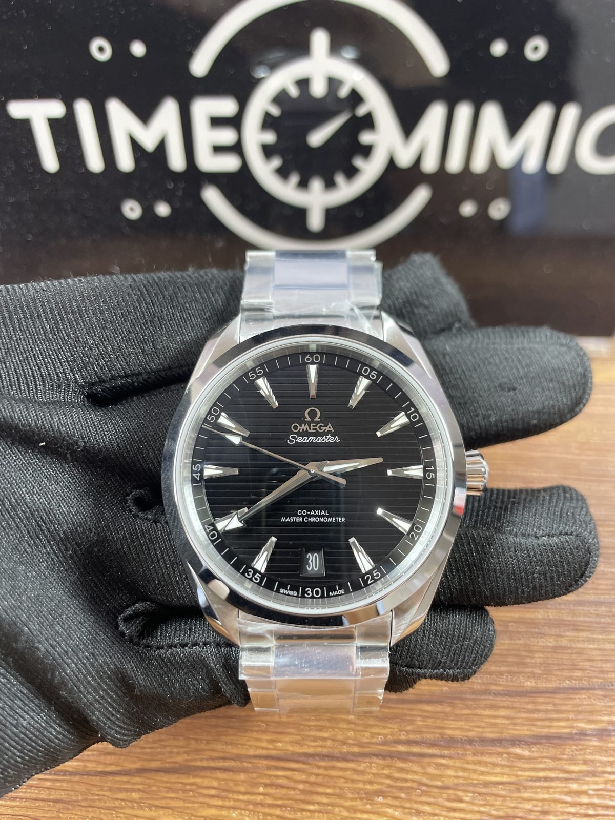 Black horizontal stripe dial Omega Aqua Terra 220.10.41.21.01.001 style replica on steel tone bracelet with date 30