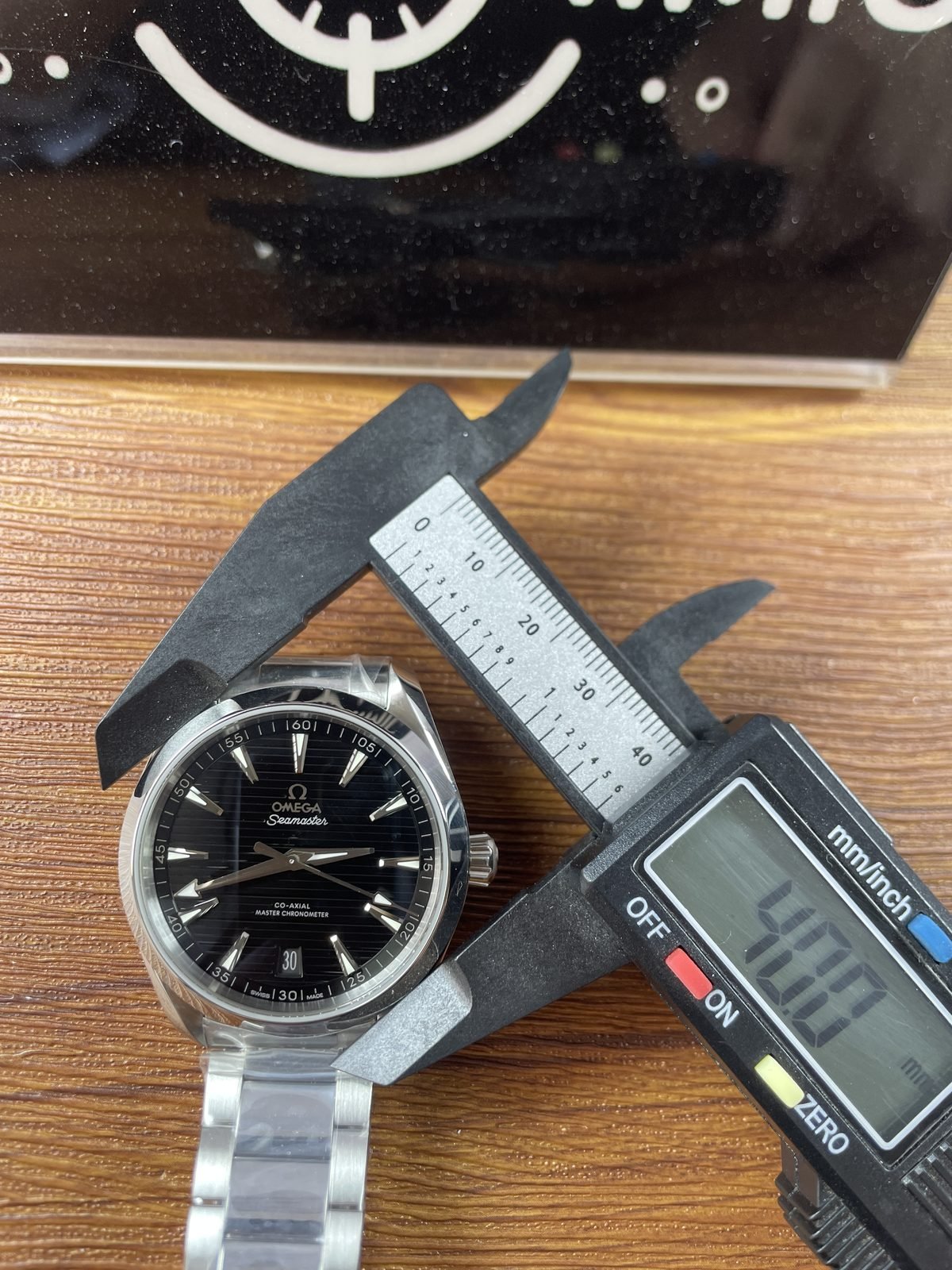 Digital calliper displaying about 40.0 millimetres across the case body of Aqua Terra replica