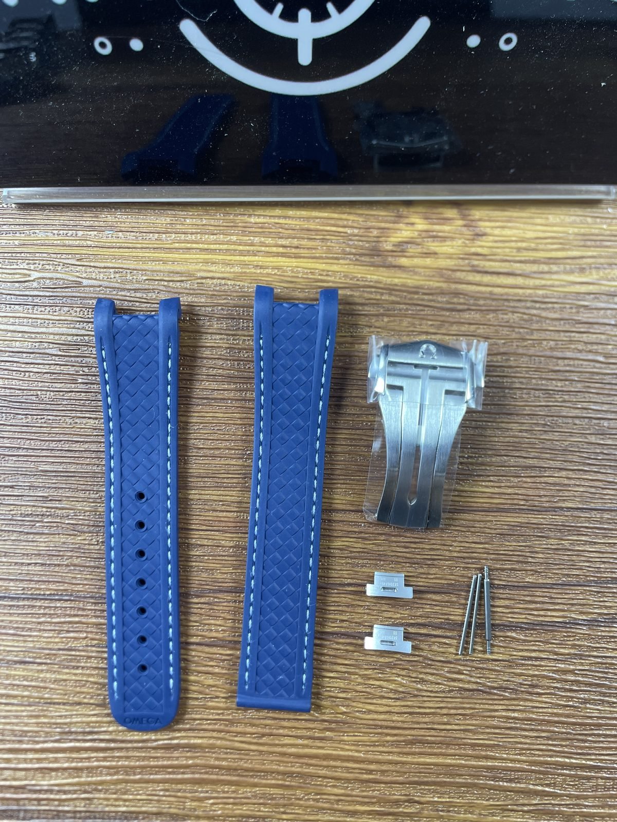 Loose blue woven texture stitched Aqua Terra strap sections detached clasp connector pieces and four pin like parts