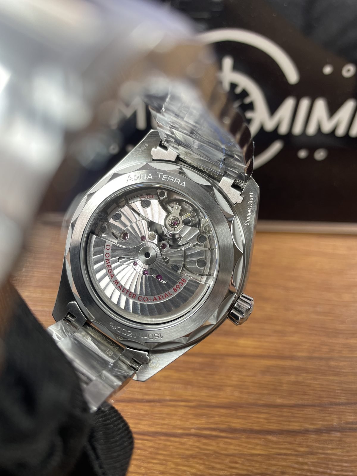 Transparent caseback of Aqua Terra Worldtimer replica with decorated automatic looking movement and 8938 style wording